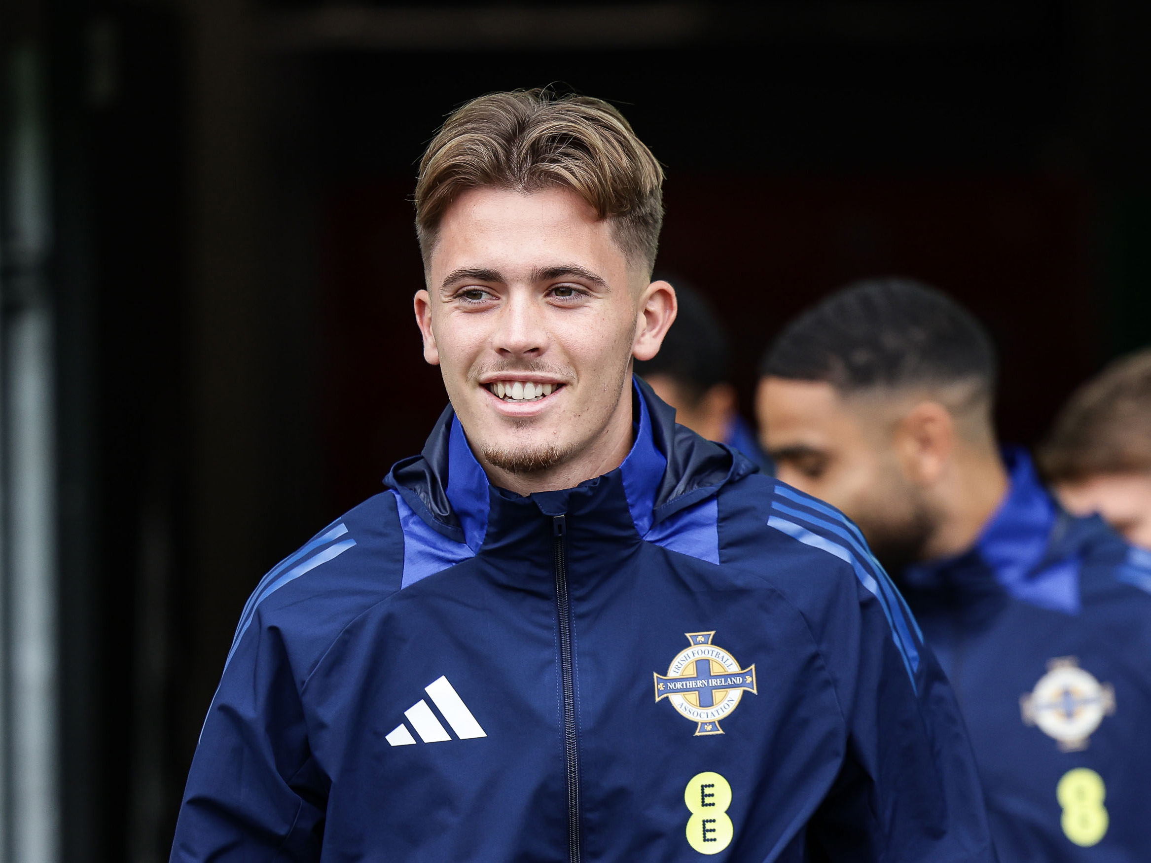 Isaac Price smiling in Northern Ireland training kit 
