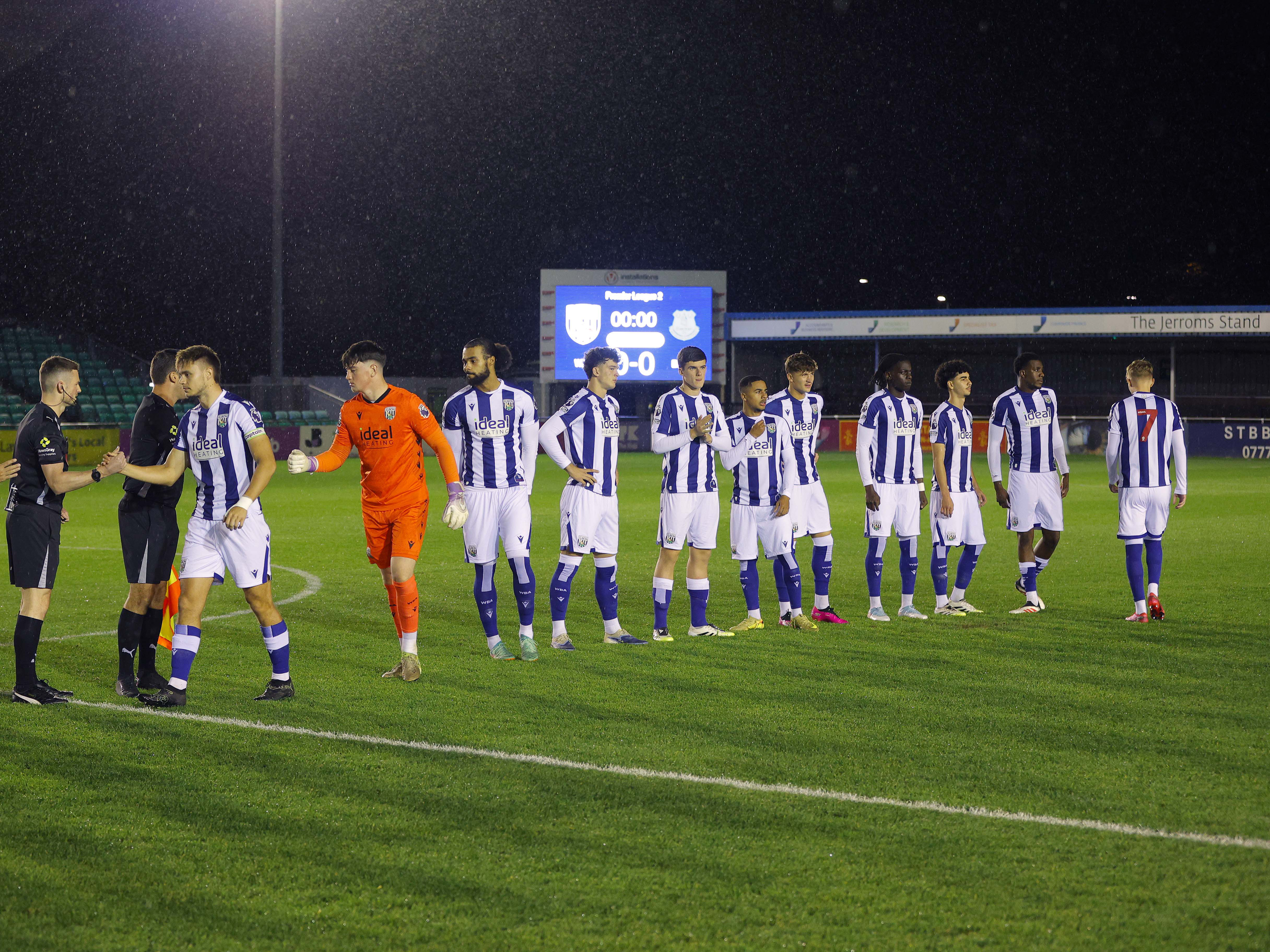 Albion's PL2 team lining up before a game in the home kit 