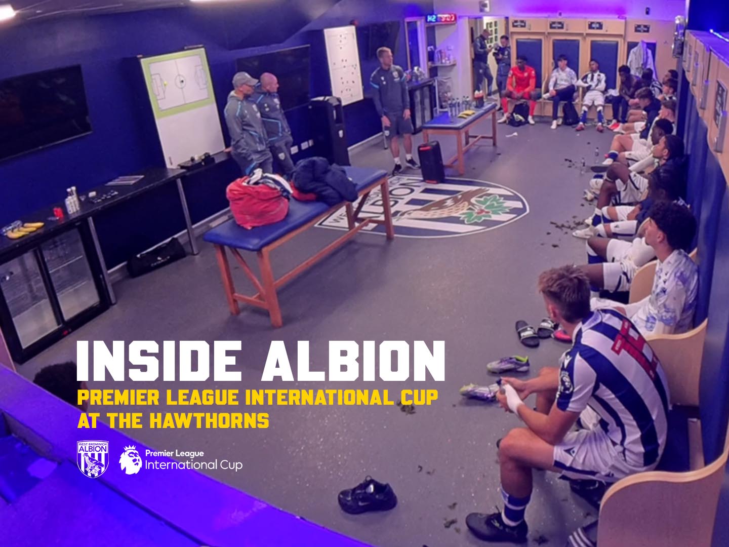Inside Albion Premier League International Cup graphic with an image inside the dressing room during a team talk on