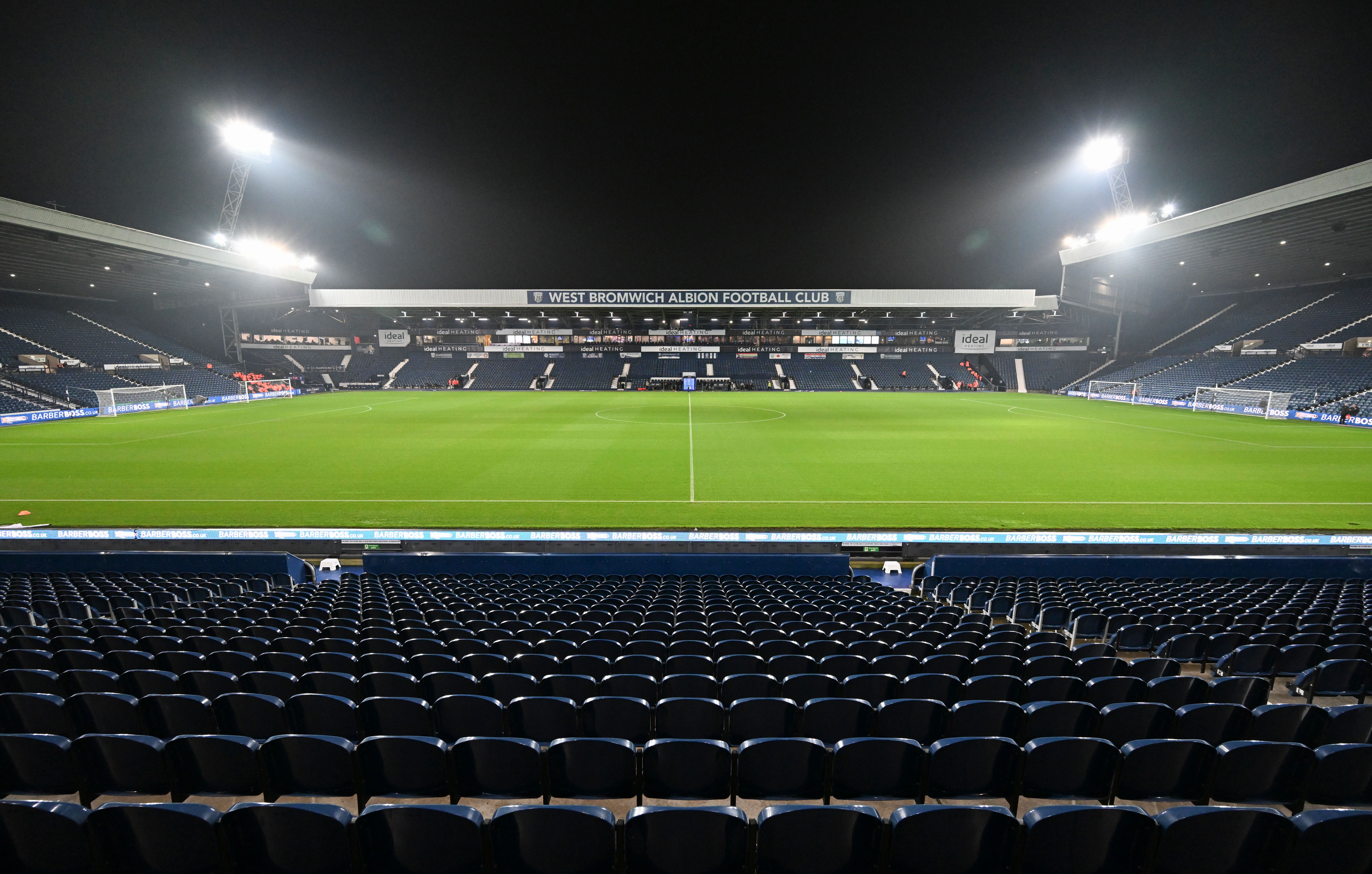 a general view of The Hawthorns at night, looking across at the West Stand from the East Stand 
