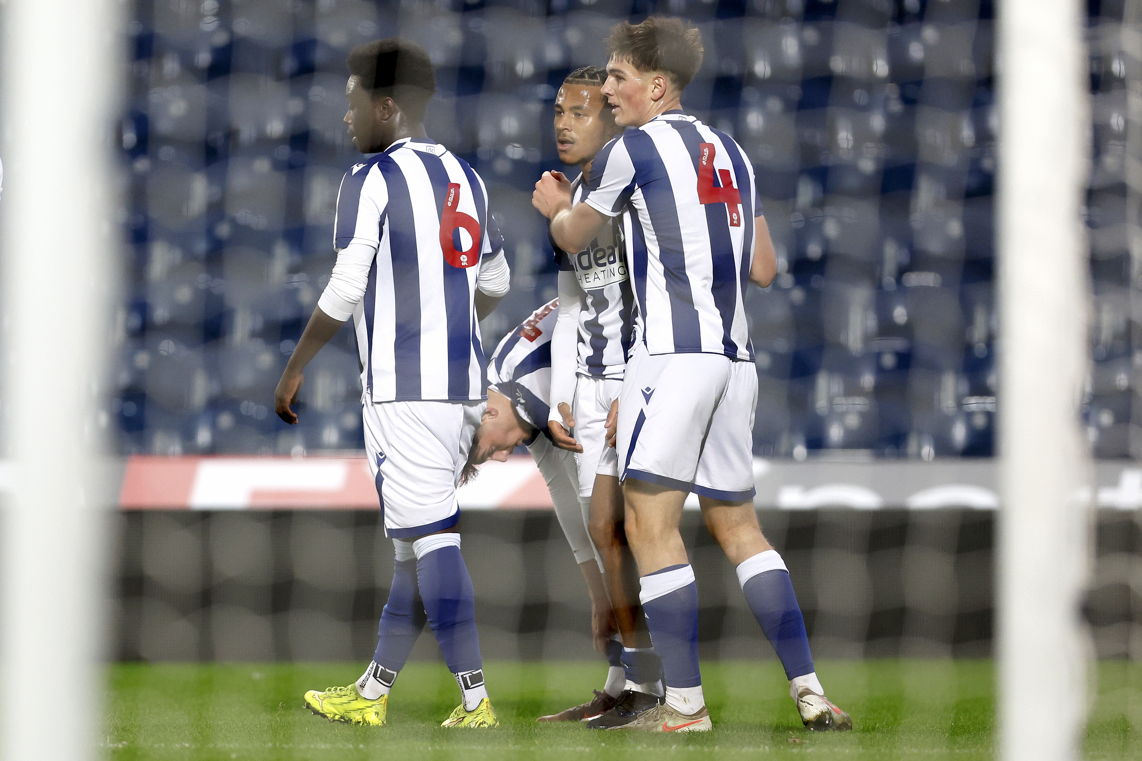 Three U18 players celebrate after a goal against Bournemouth 