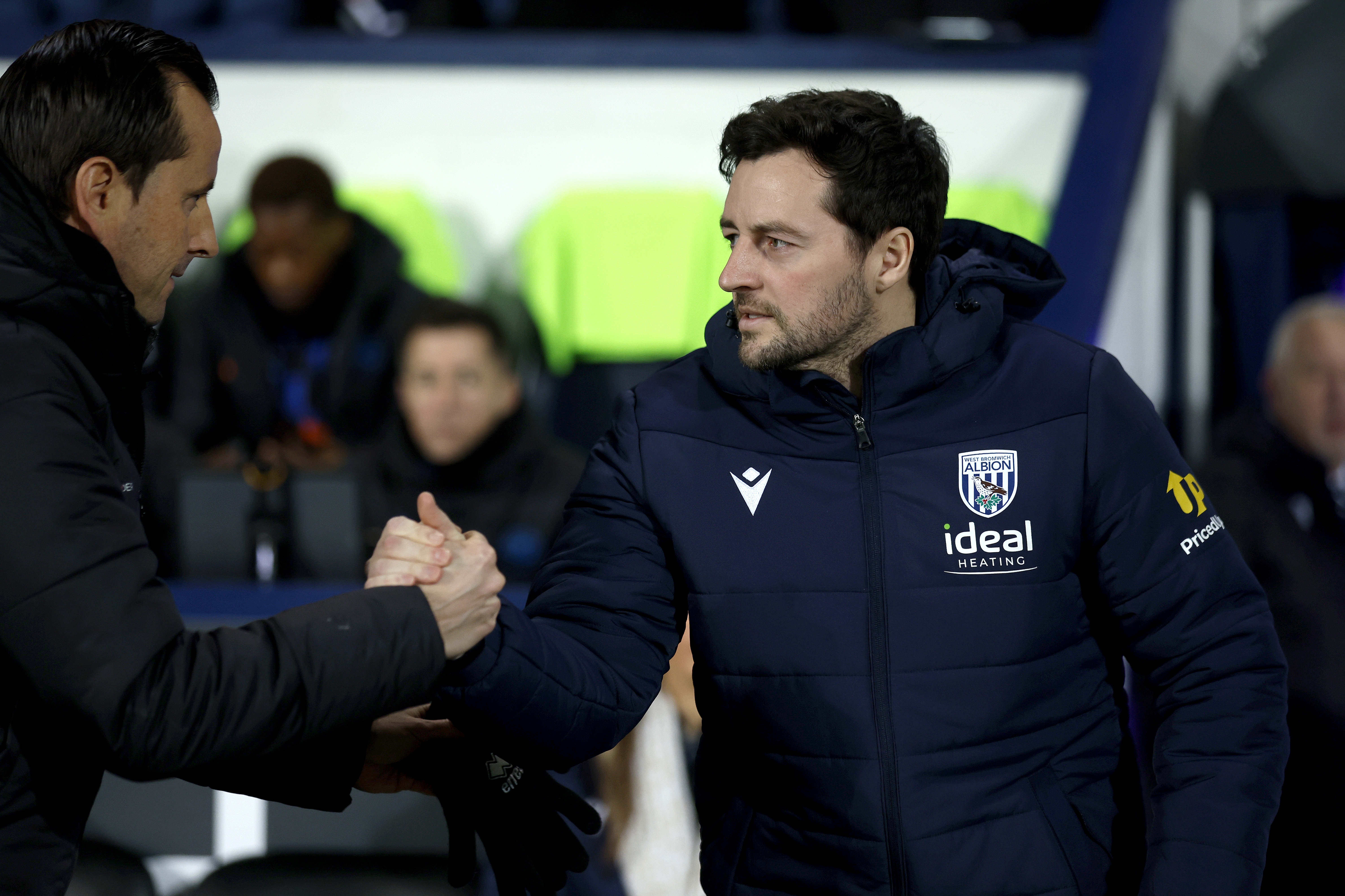 Ryan Mason shaking hands with the QPR manager before the game at The Hawthorns 