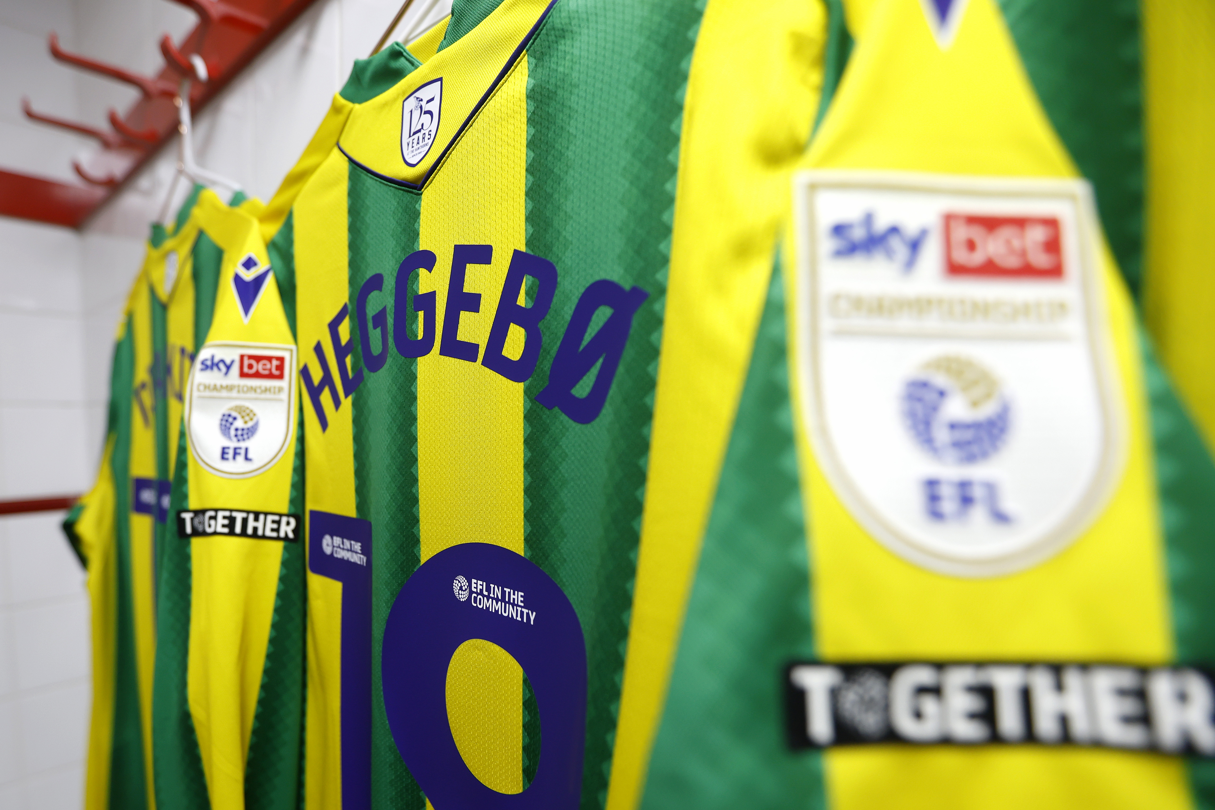 the back of Aune Heggebø's green and yellow away shirt 