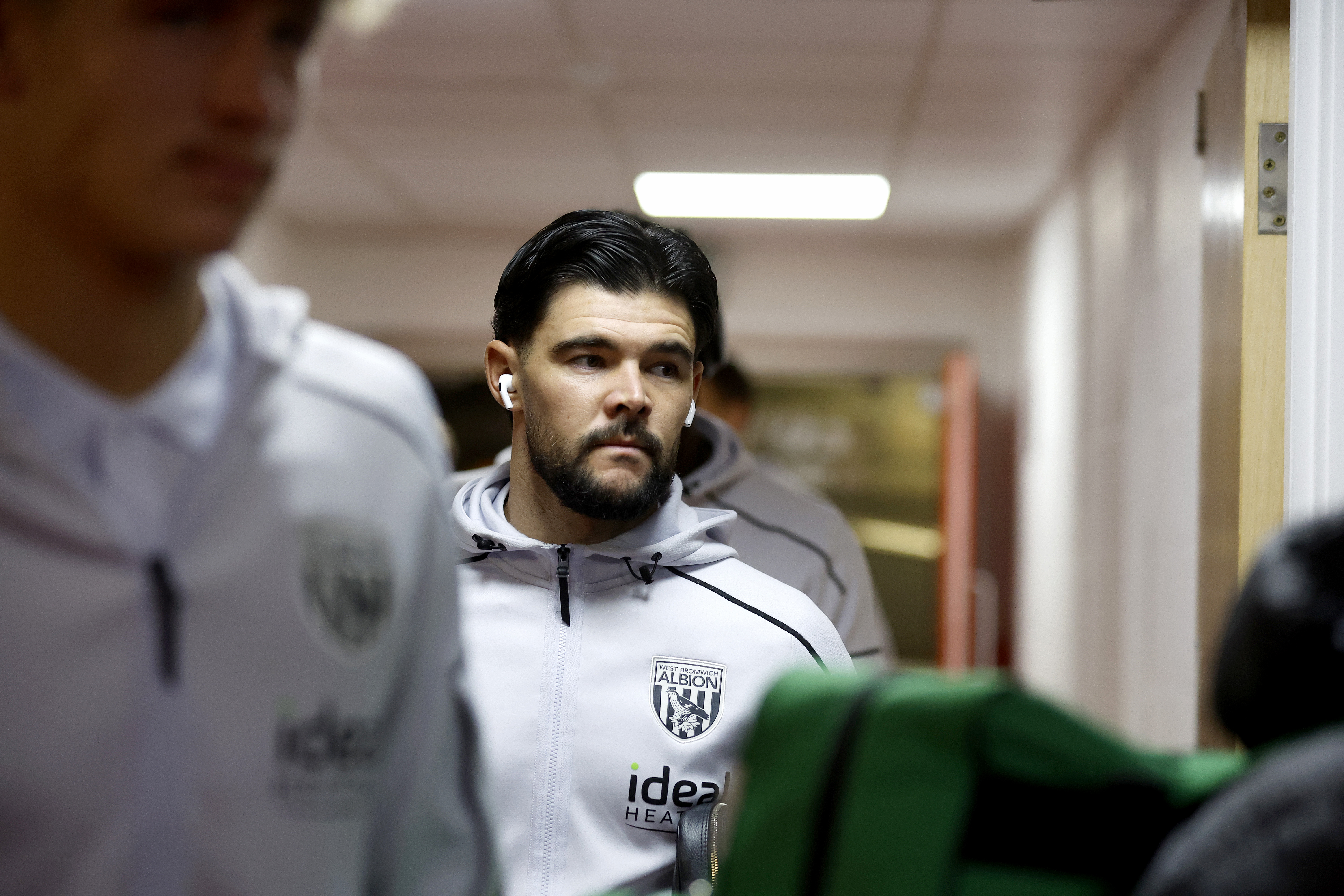 Alex Mowatt arriving at a game in his WBA tracksuit 