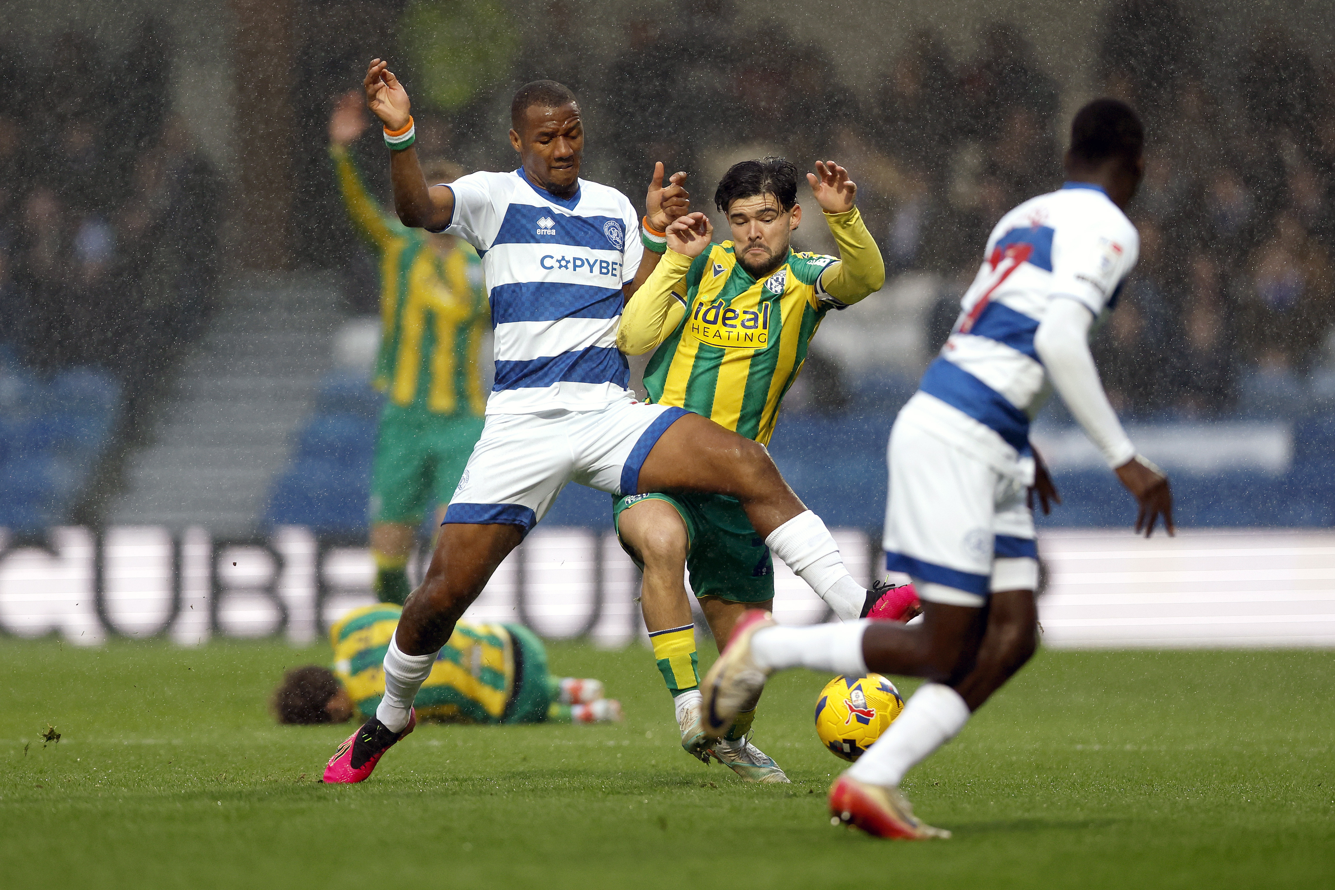 Alex Mowatt fights for the ball with a QPR player