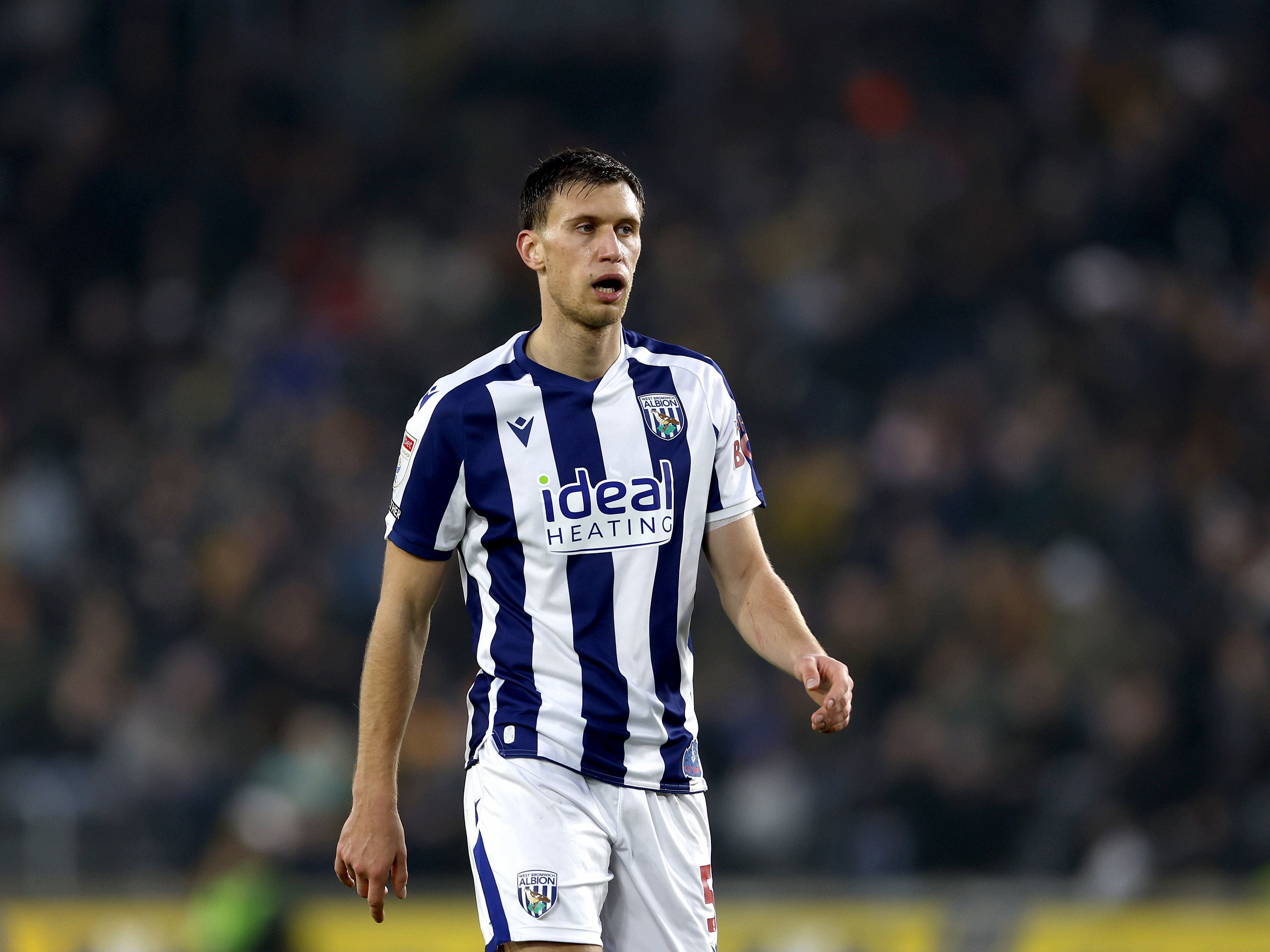 Krystian Bielik in action for WBA in the home kit 