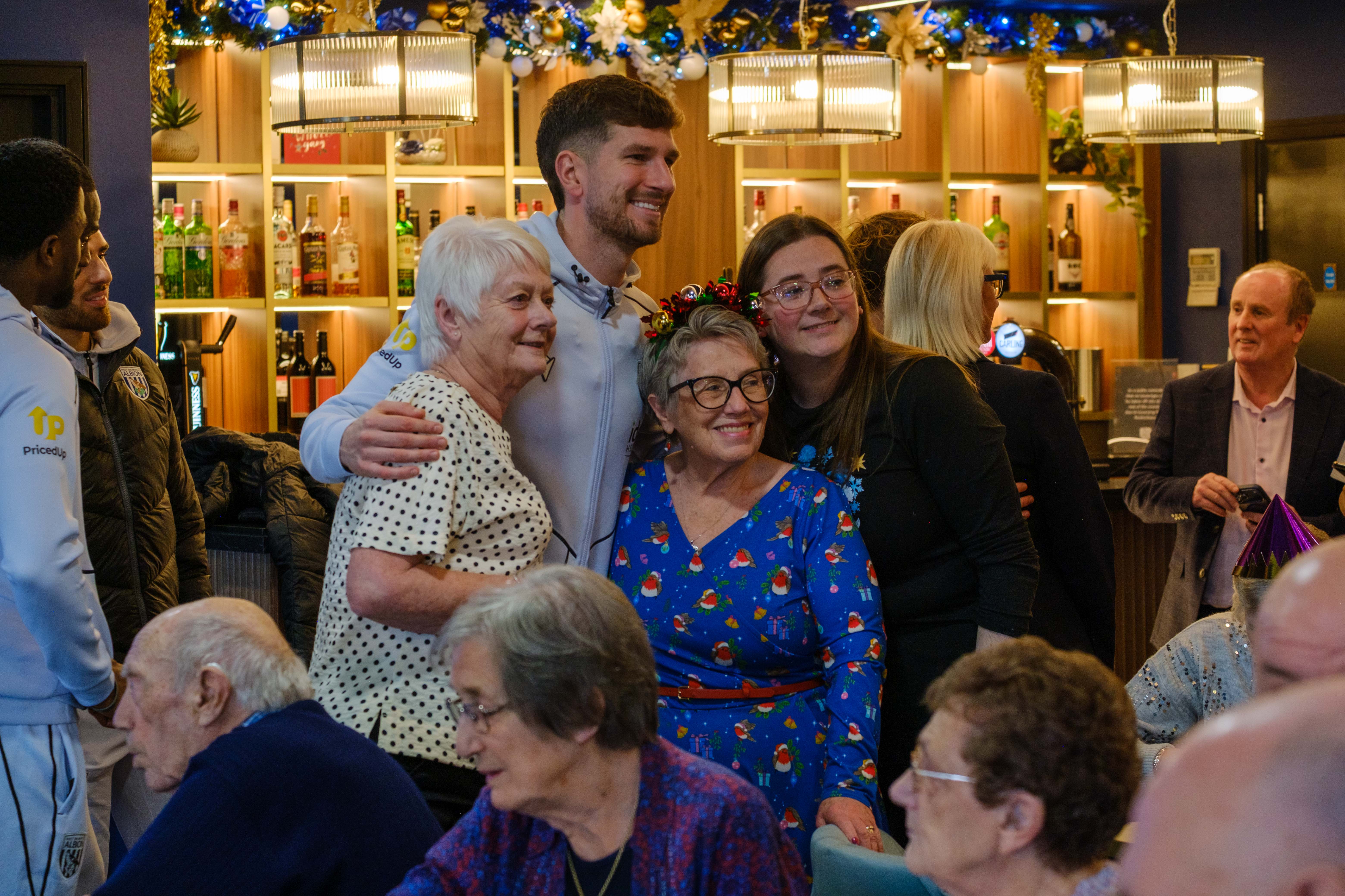 Mepham taking a photo with participants.