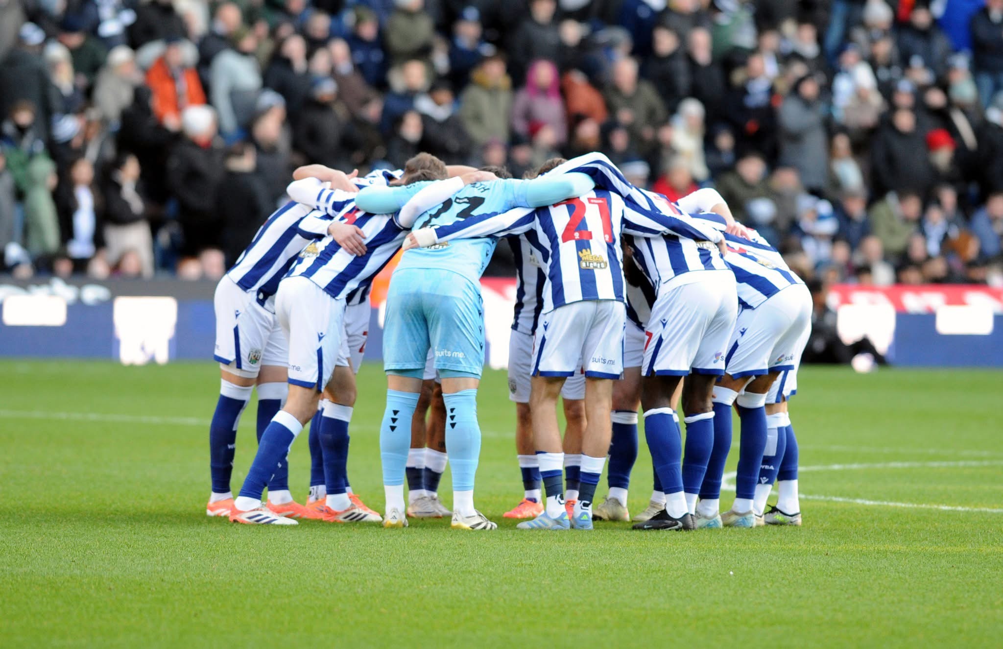 WBA in a team huddle before a home game 