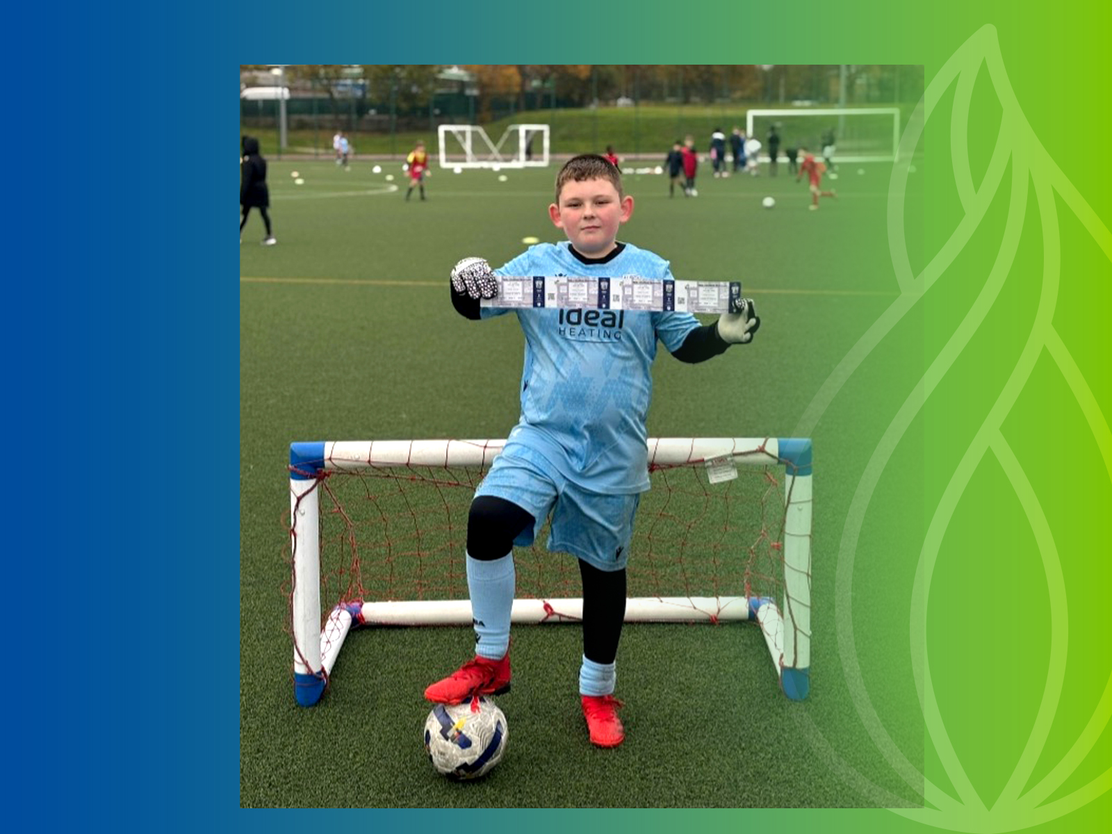 Callum holding a four tickets with his foot on a ball.