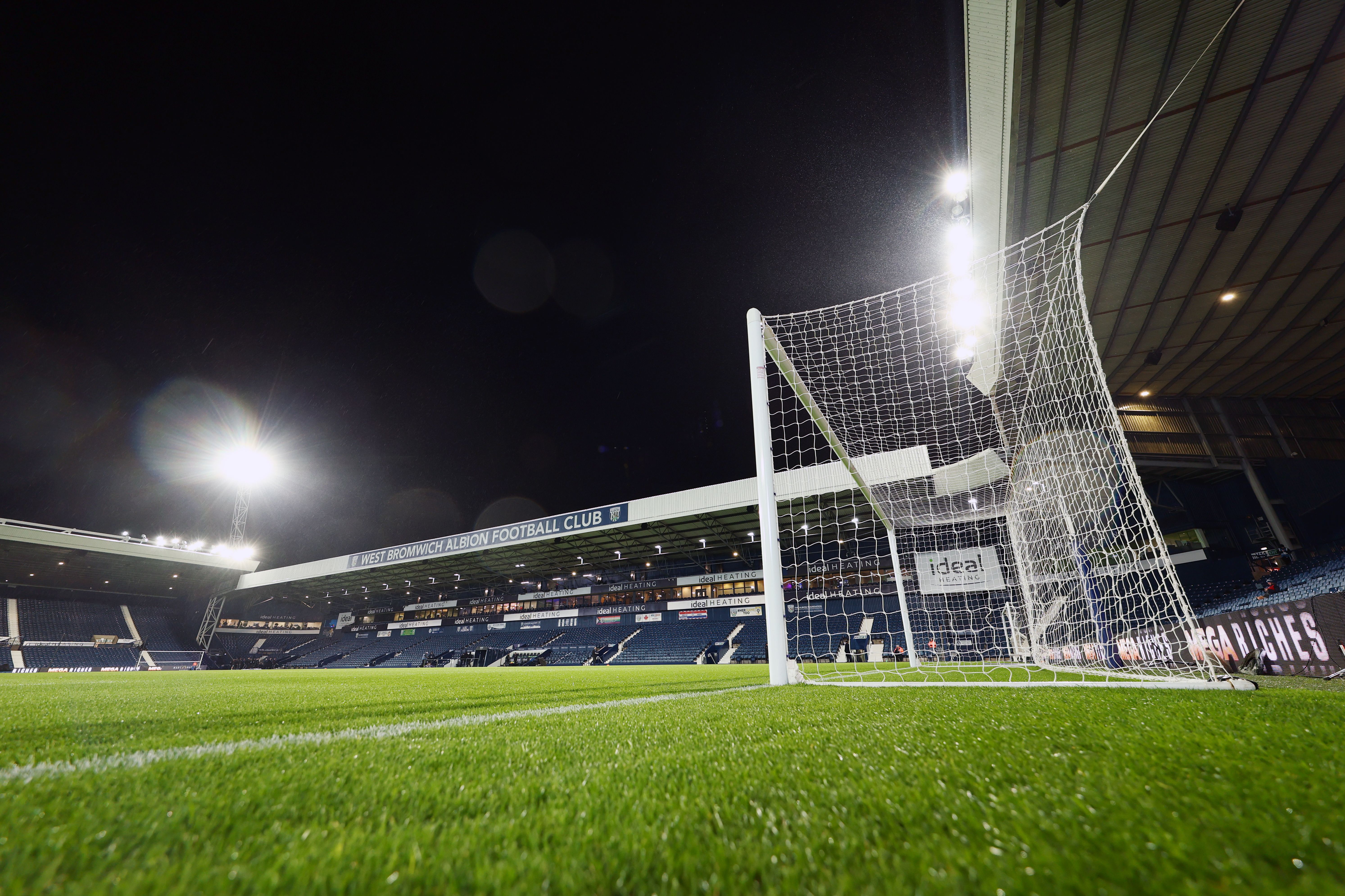 A general view of The Hawthorns and a goal at night 
