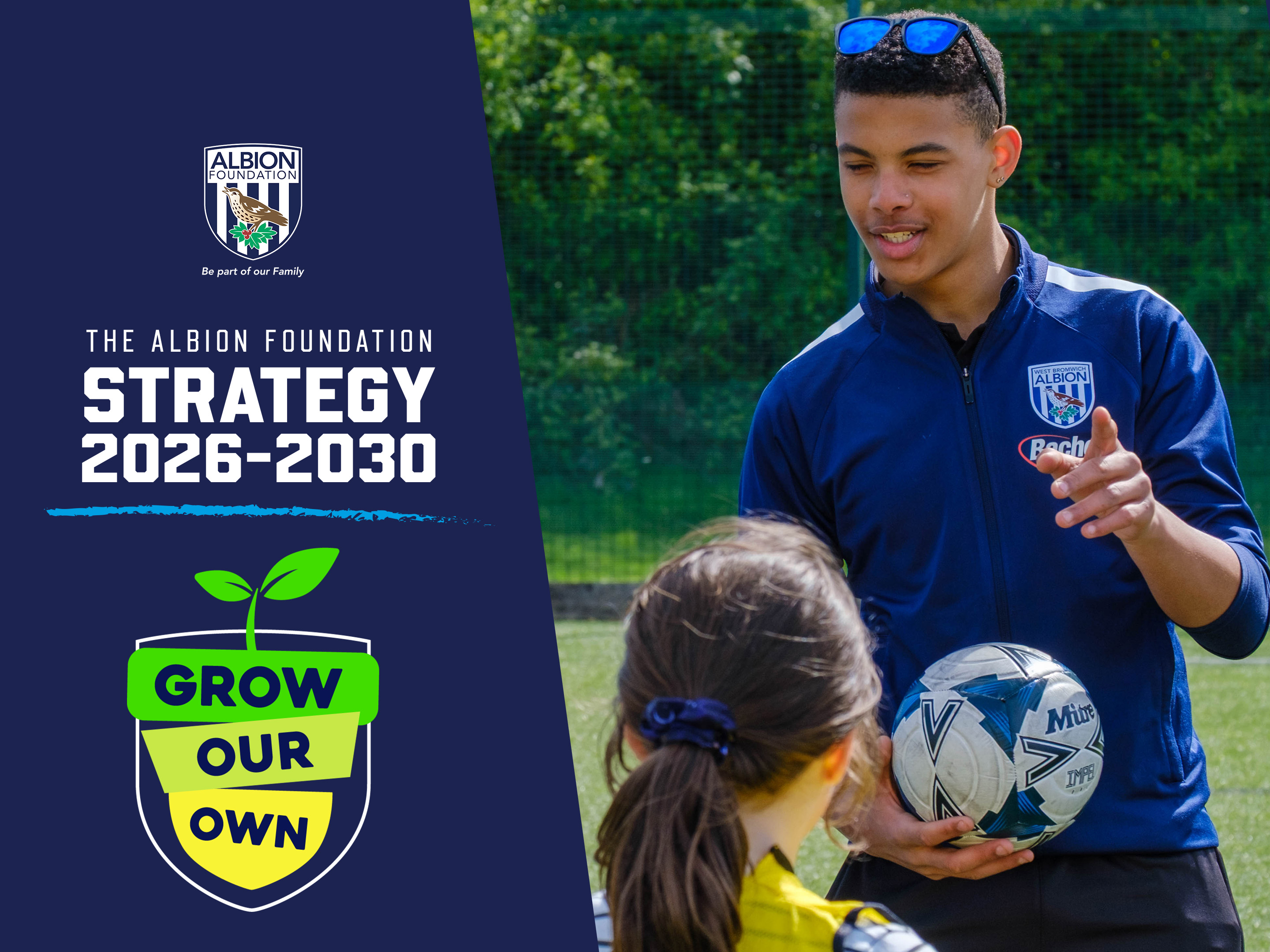 Legacy Leader Arlo, holding a ball, talking to young participant.