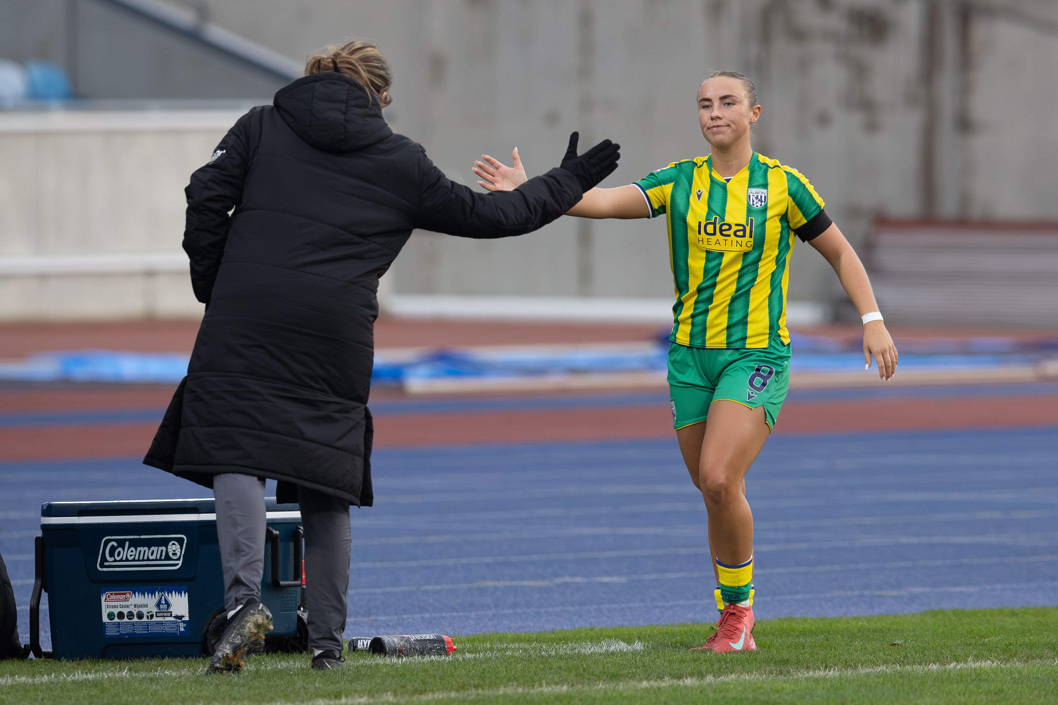 Seren Watkins high-fives Siobhan Hodgetts-Still.
