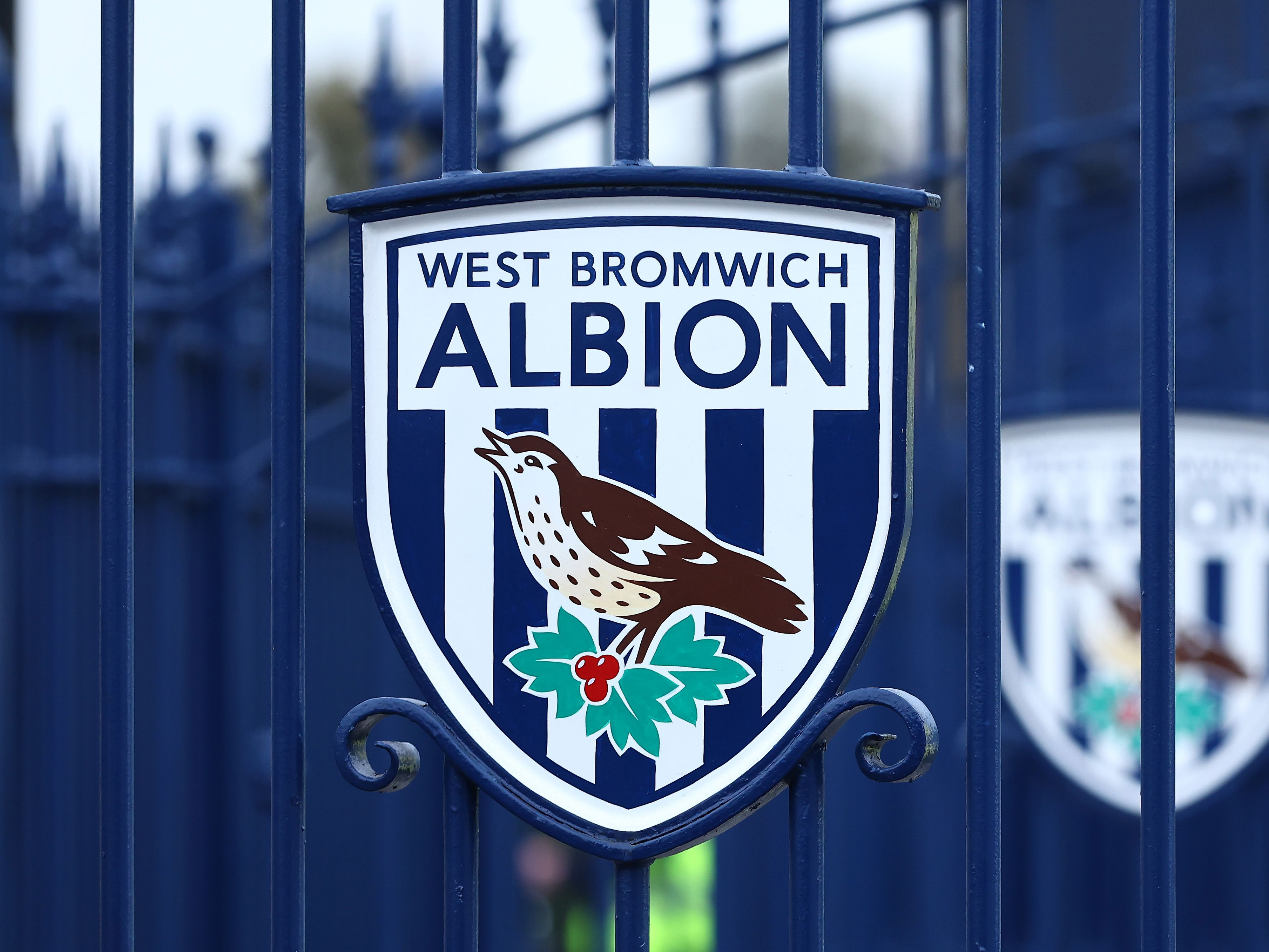 An image of a WBA badge on a gate at The Hawthorns