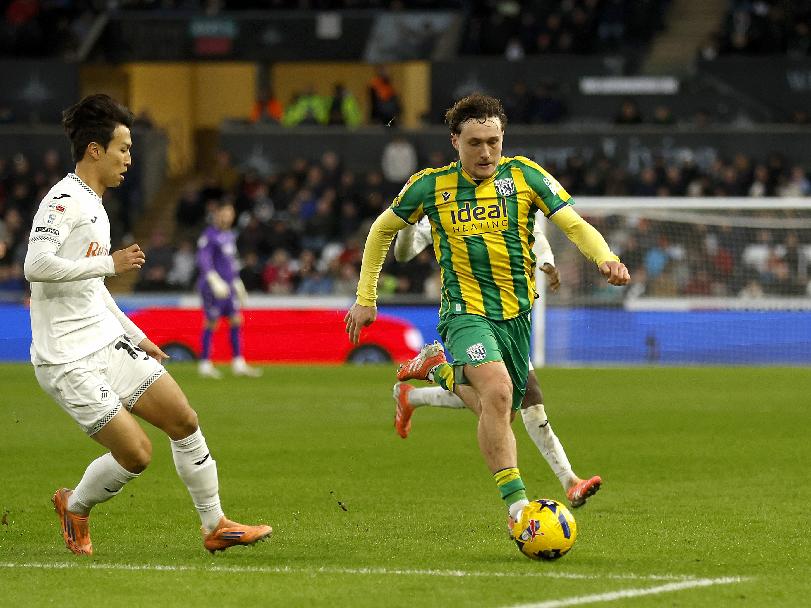 An image of Callum Styles on the ball against Swansea