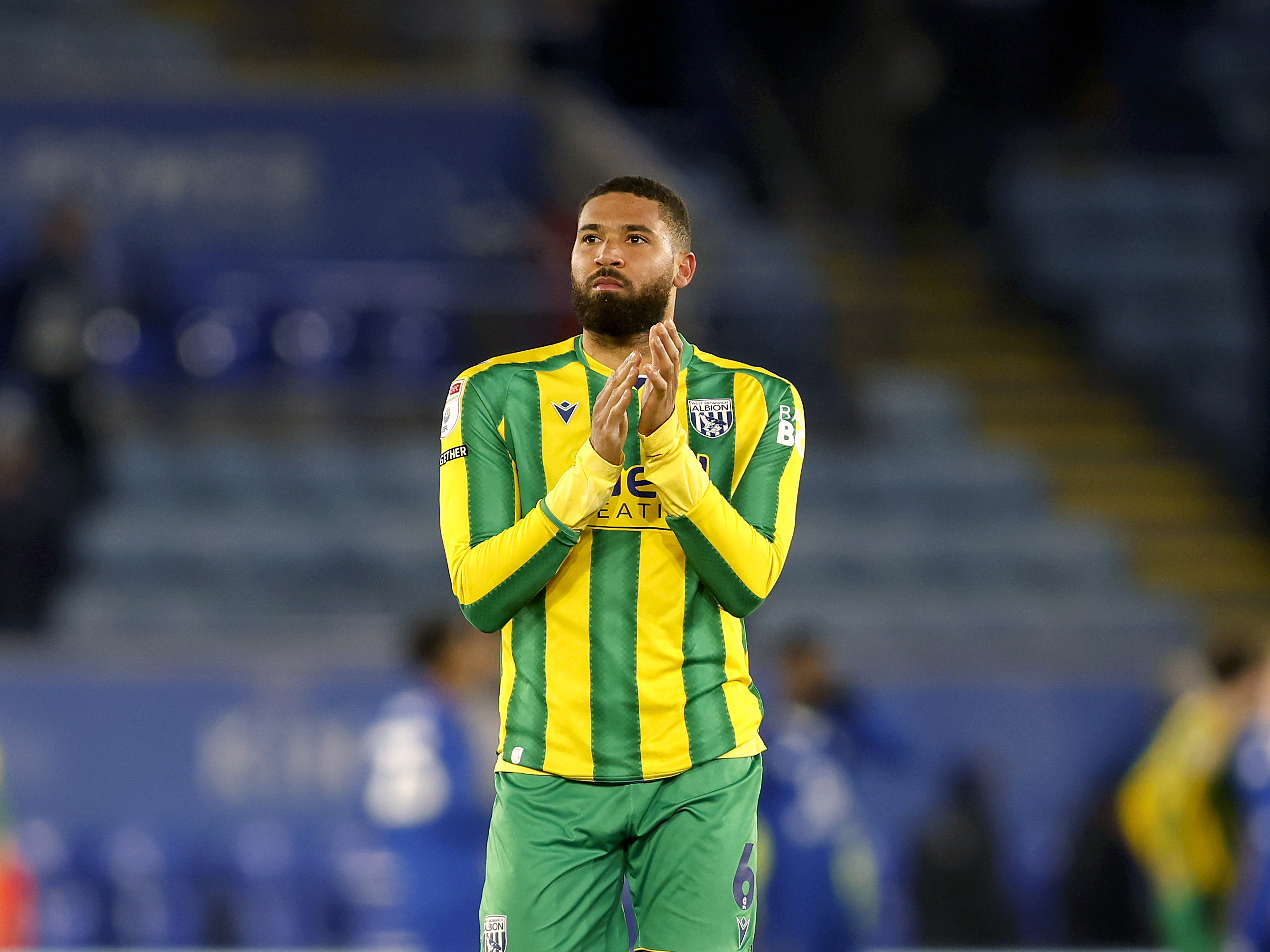 A photo of Albion defender George Campbell in the 2025/26 green and yellow away kit