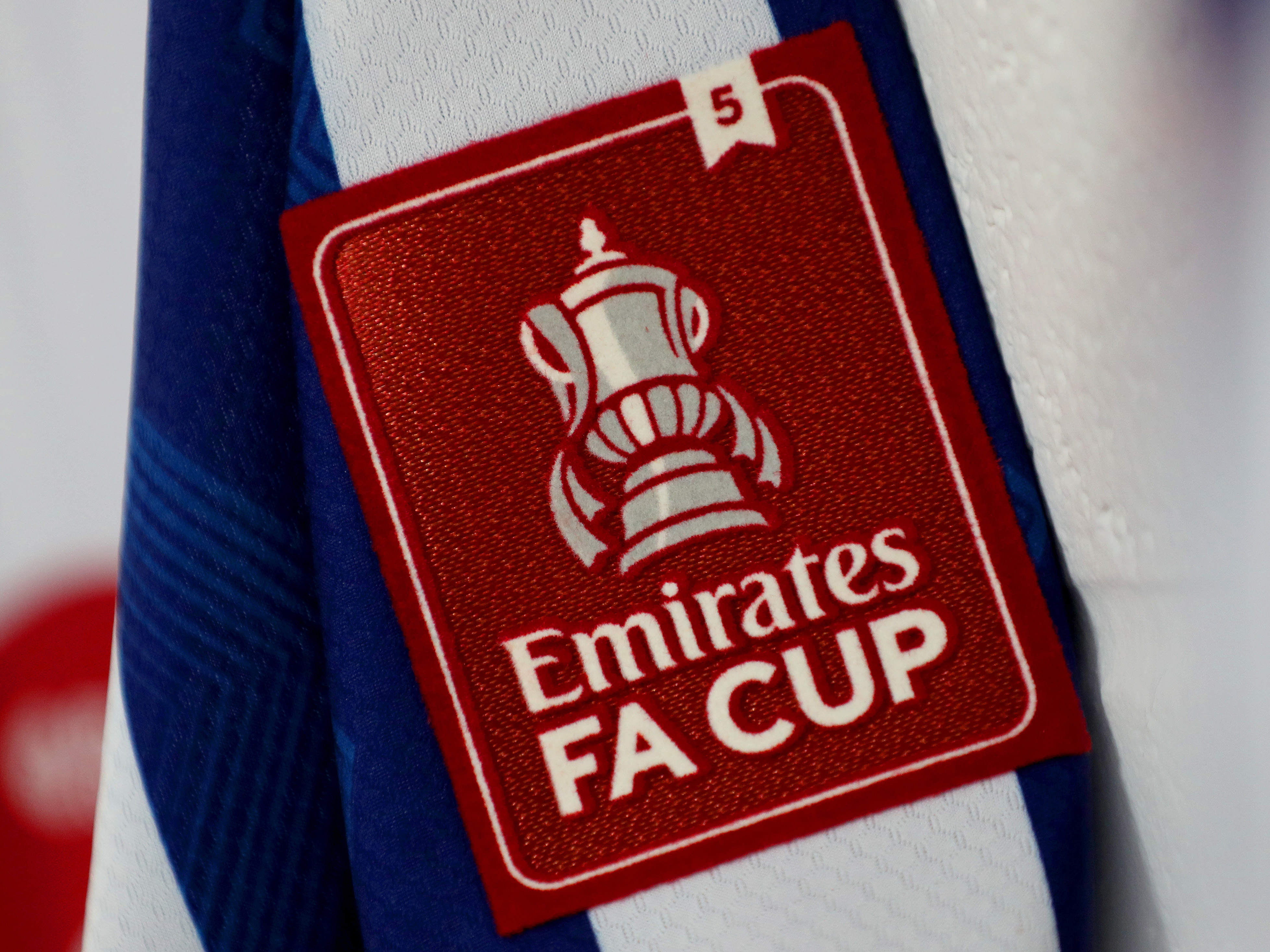 An FA Cup logo on a home WBA shirt 