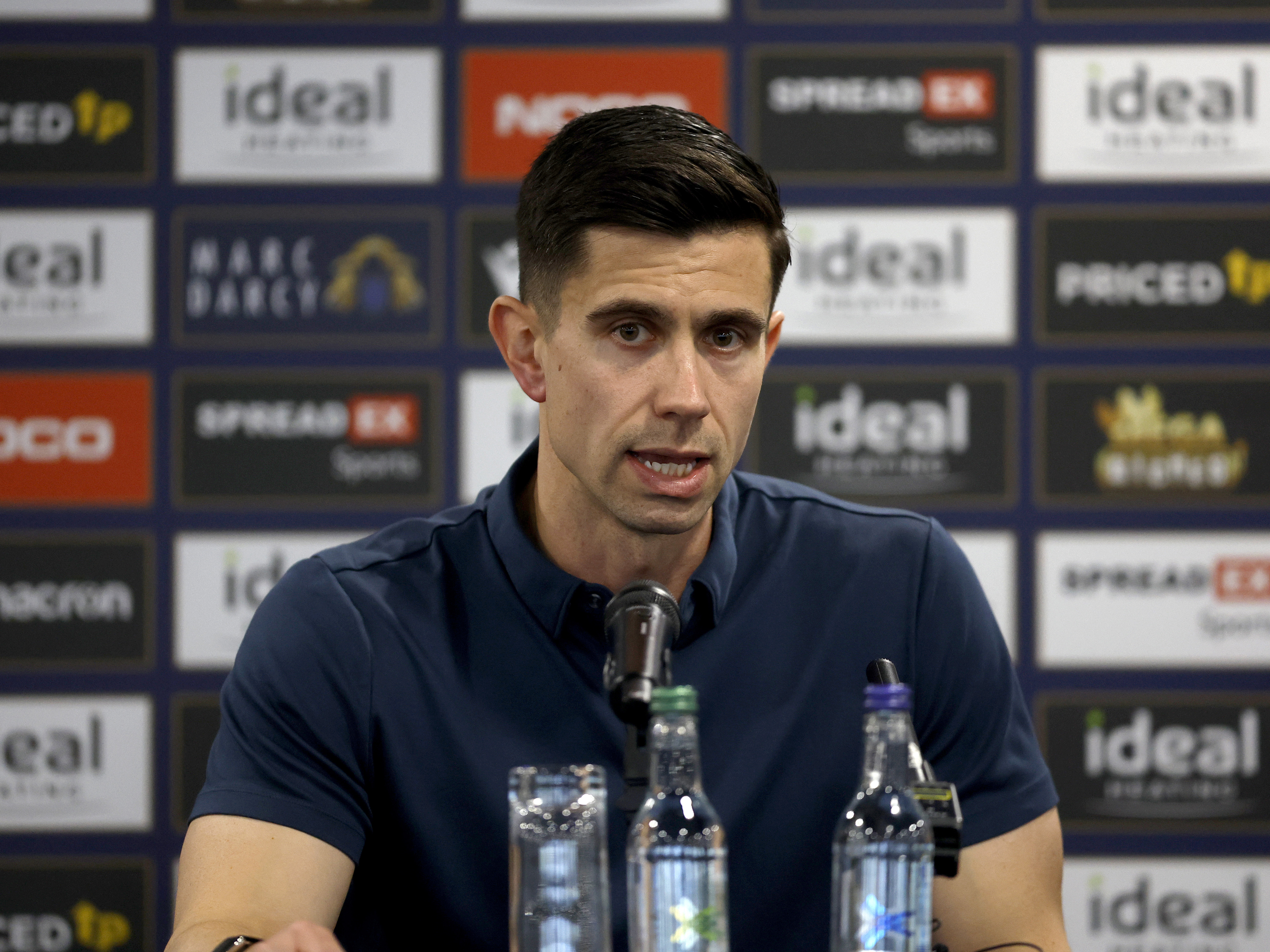 Eric Ramsay speaking to the media in a press conference 