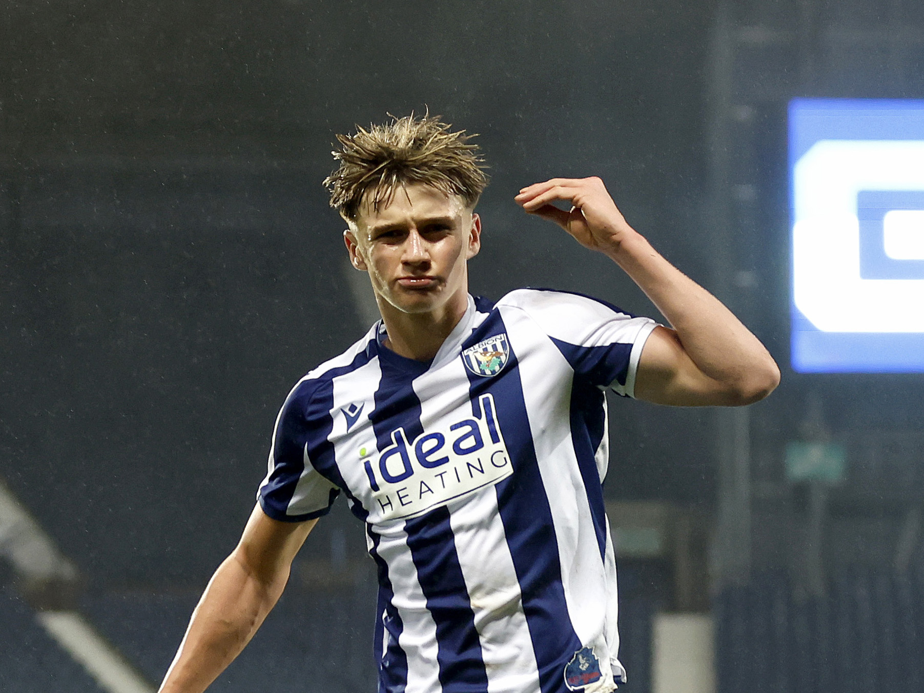 Harry French celebrating a goal in the home kit 