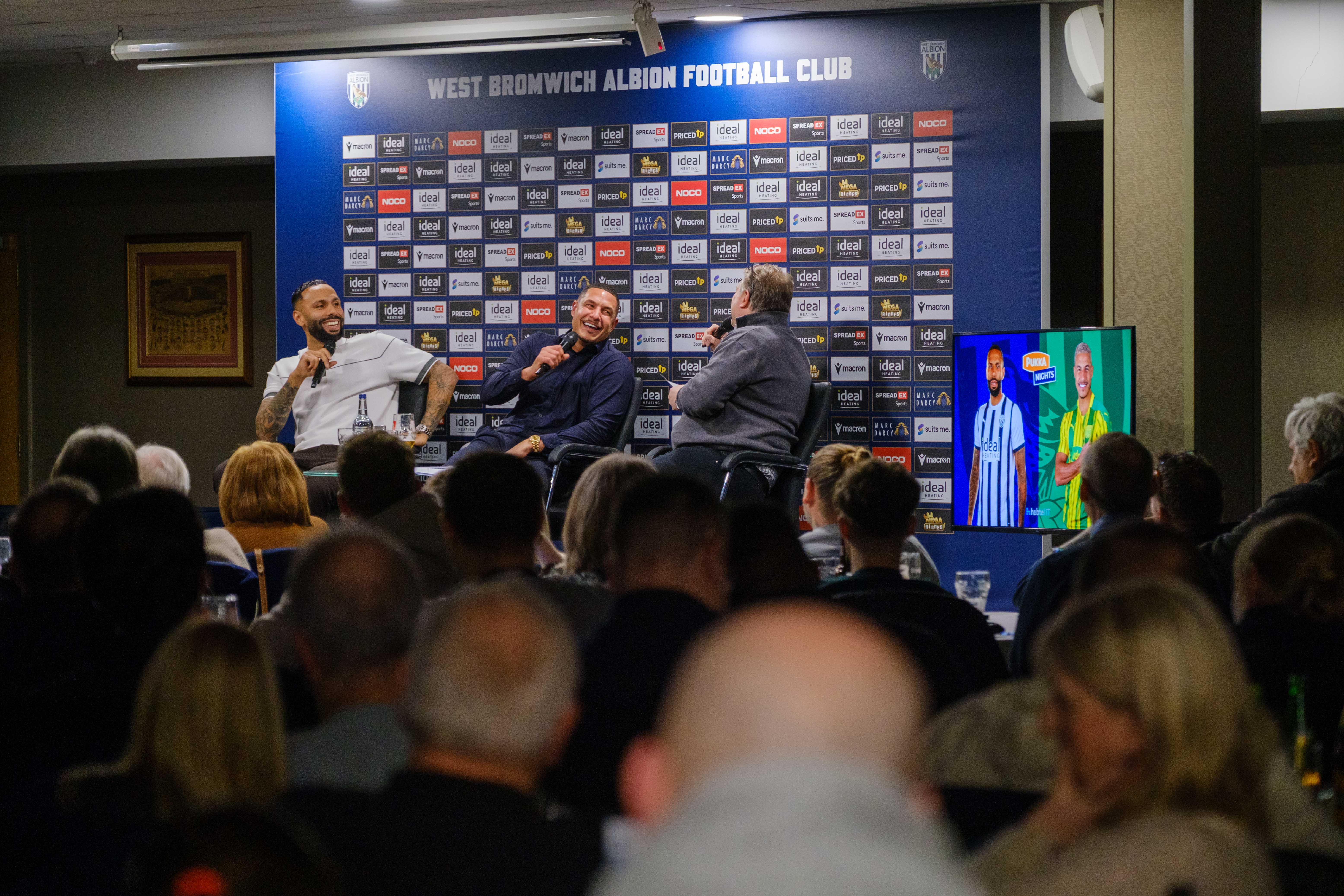 Andy Johnson, Kyle Bartley and Jake Livermore on stage laughing and talking