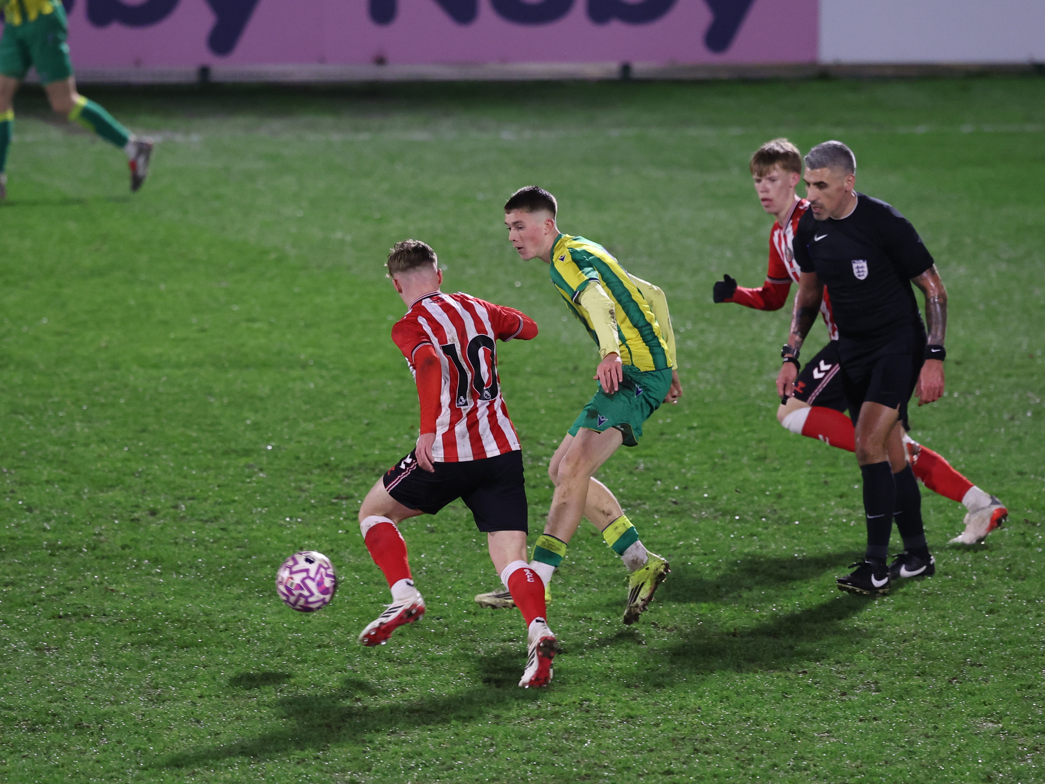 A photo of Albion U18 player Ryan Colesby in the 2025/26 green and yellow away kit