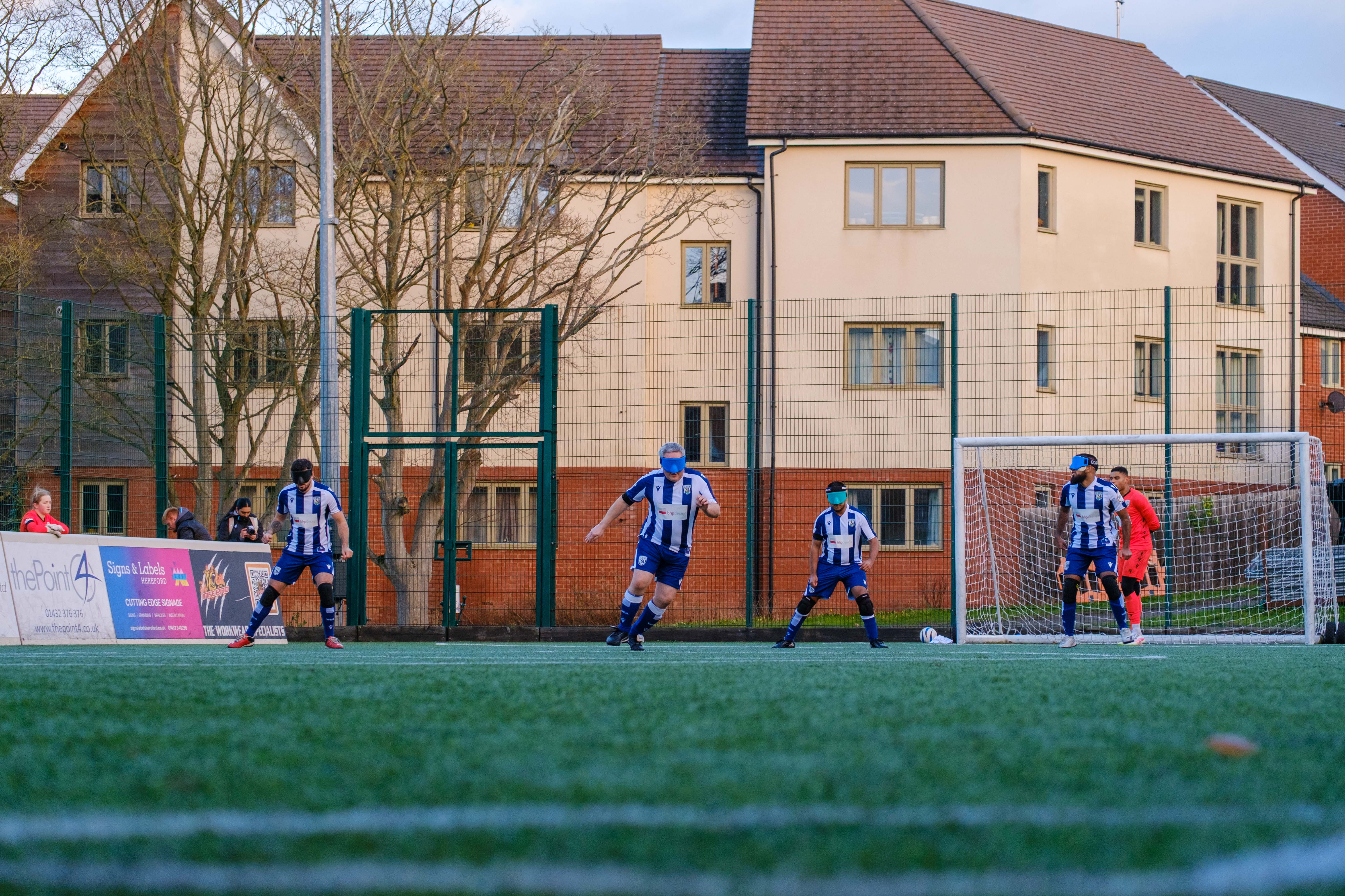 Wide shot of WBA Players on the pitch.