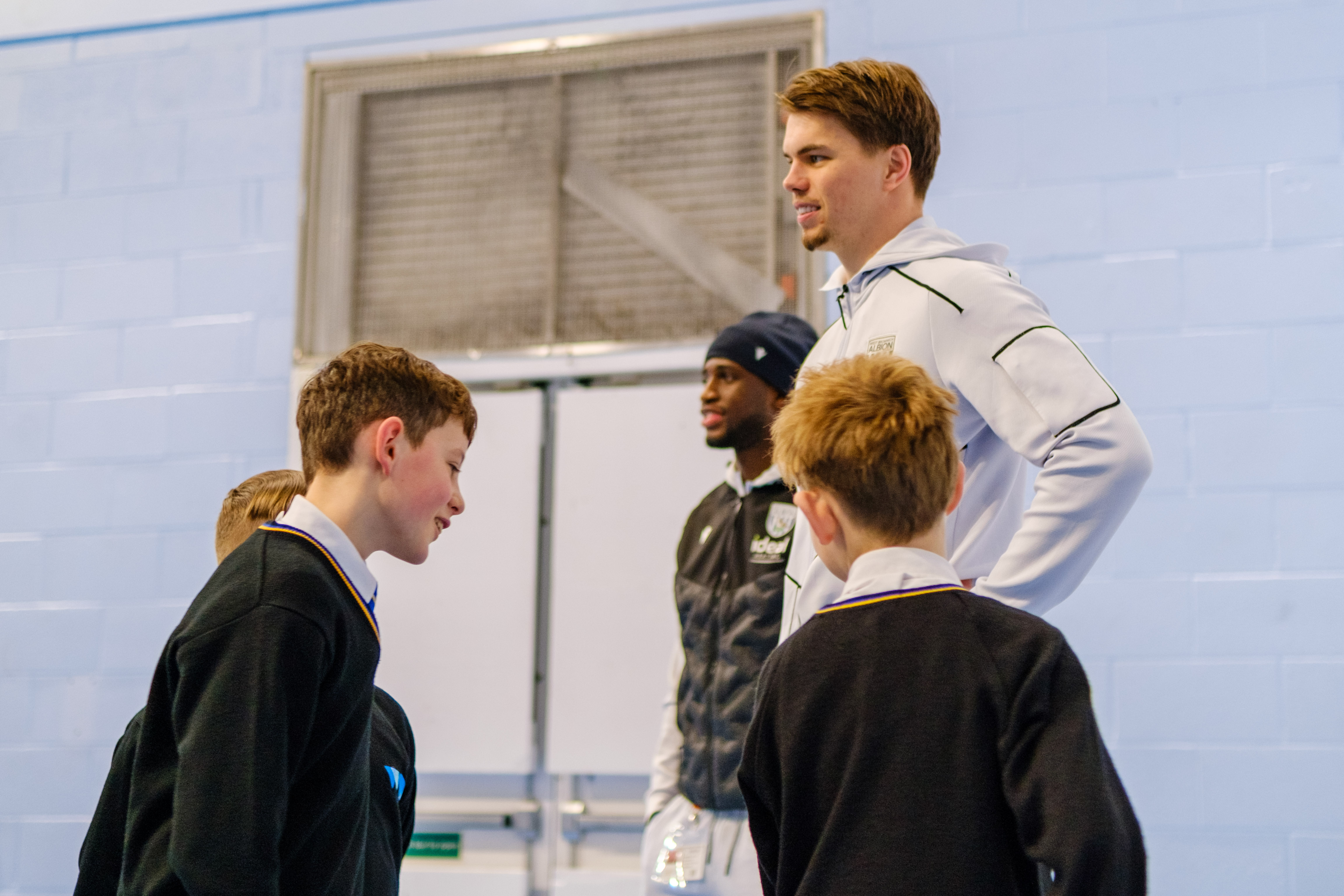 Samuel Lling Junior and Josh Griffiths taking part in an activity with pupils