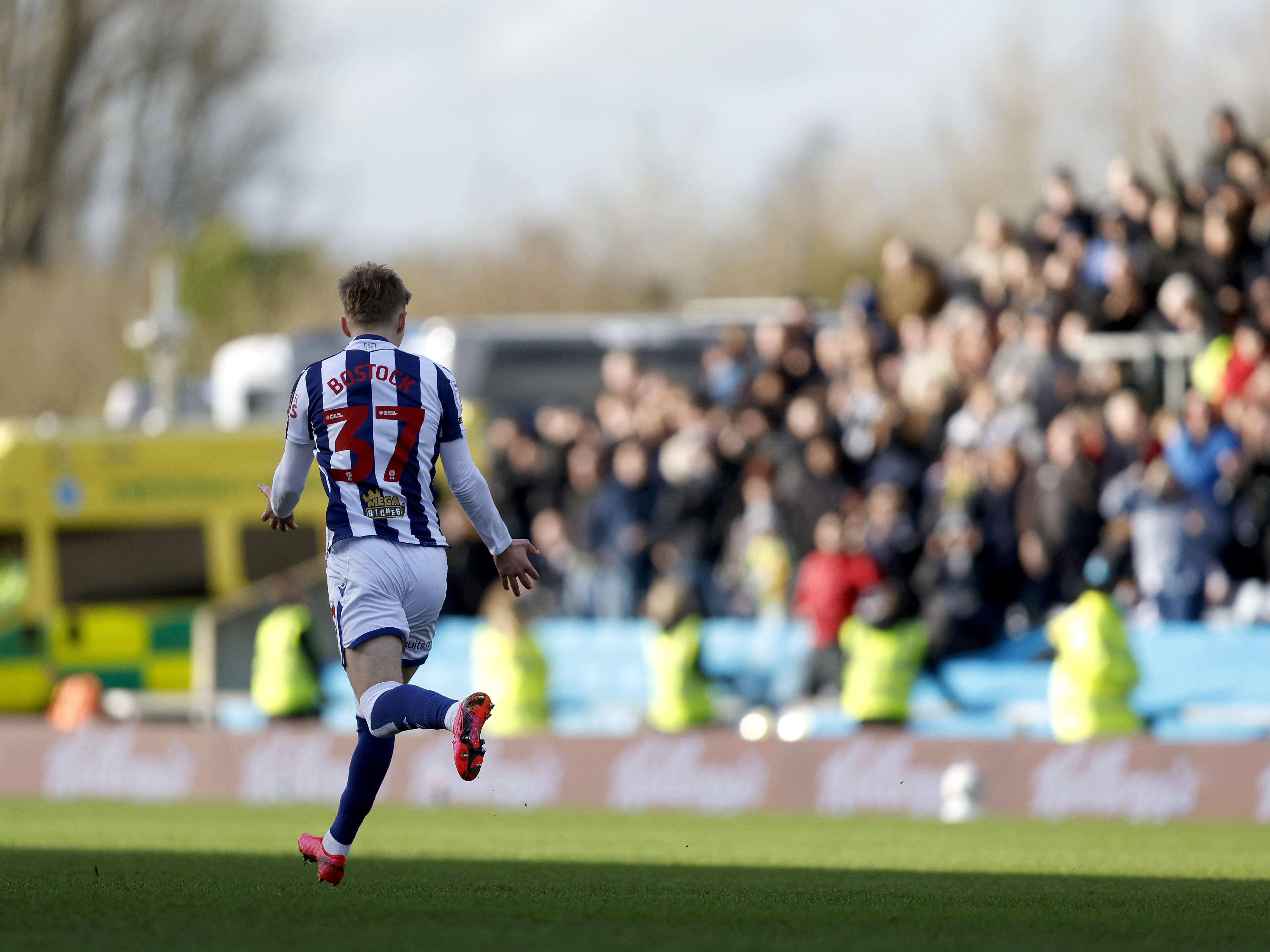 An image of Ollie Bostock celebrating his goal against Oxford