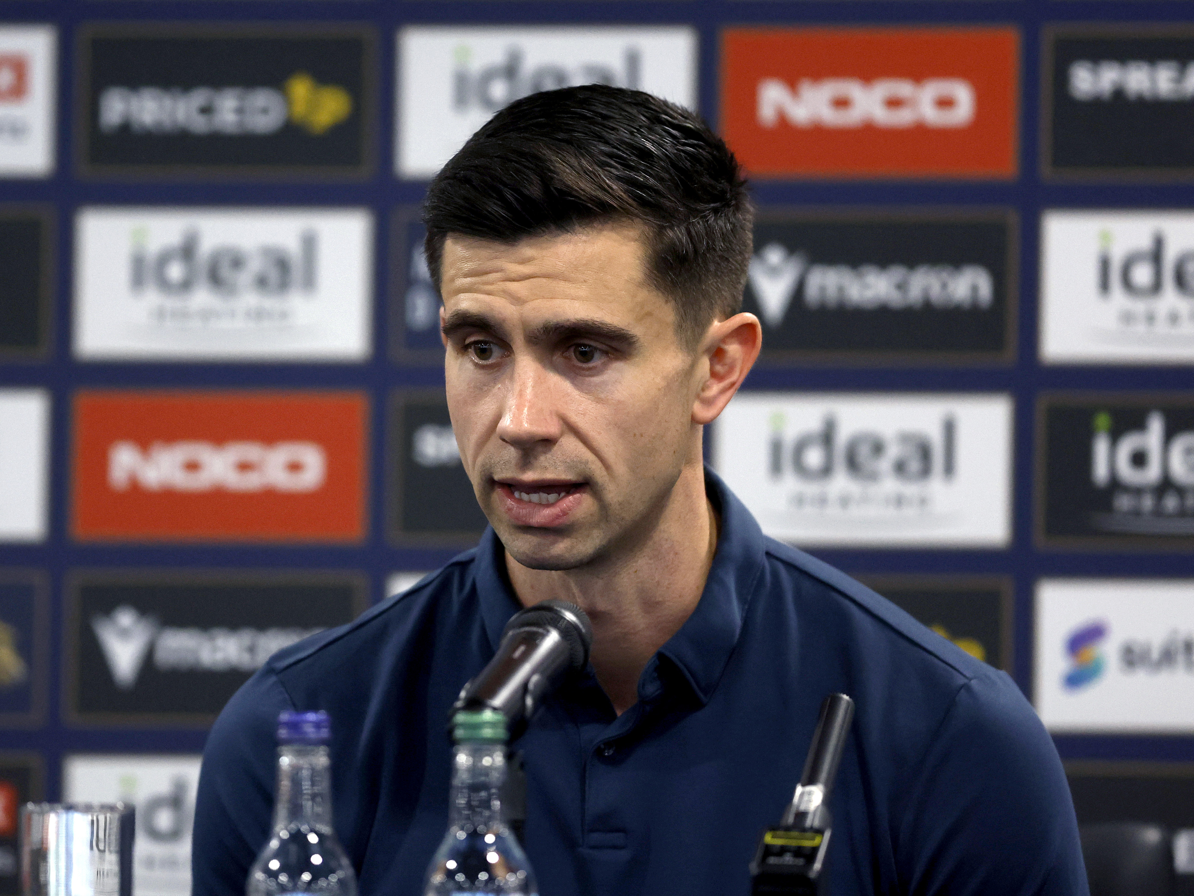 Eric Ramsay speaking to the media in a press conference 