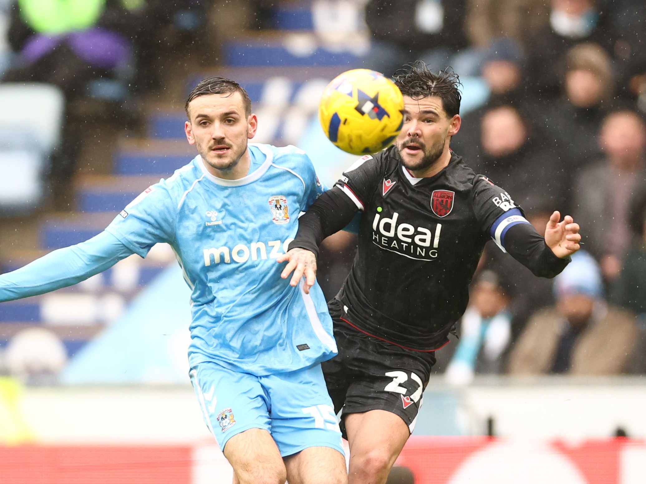 Alex Mowatt battling for the ball with a Coventry player 