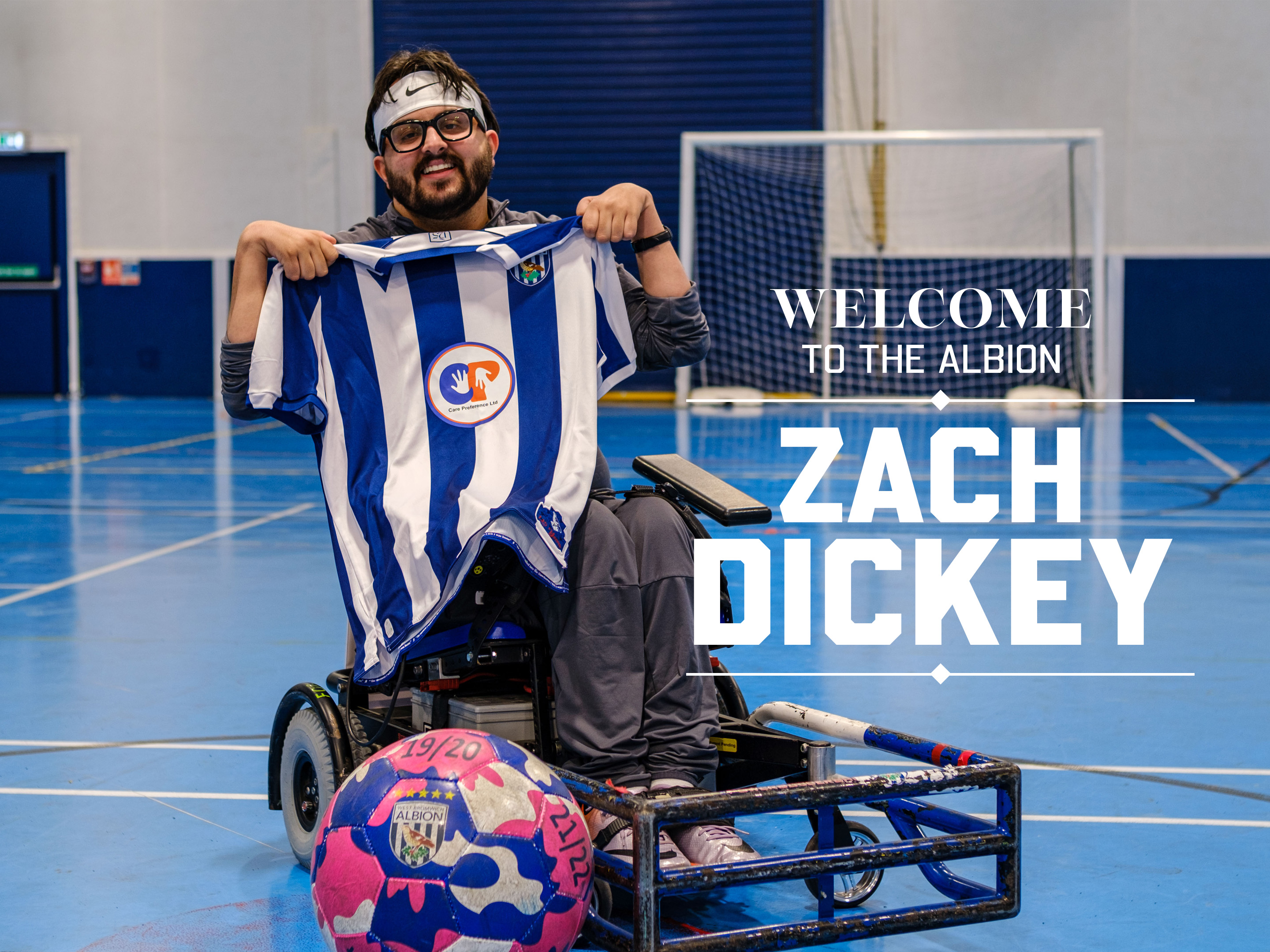 Zach Dickey holding the shirt