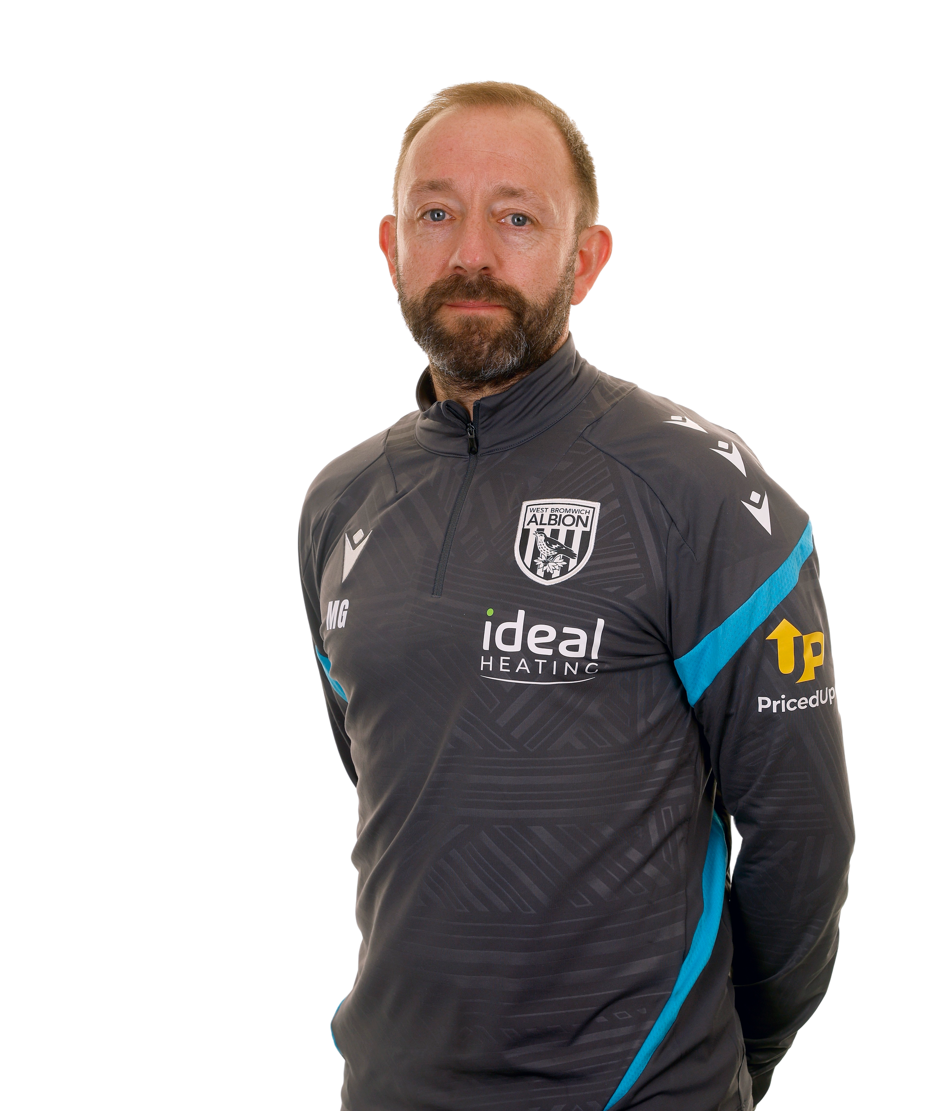 A club headshot of First Team Coach Matt Gill in the 2025/26 training kit