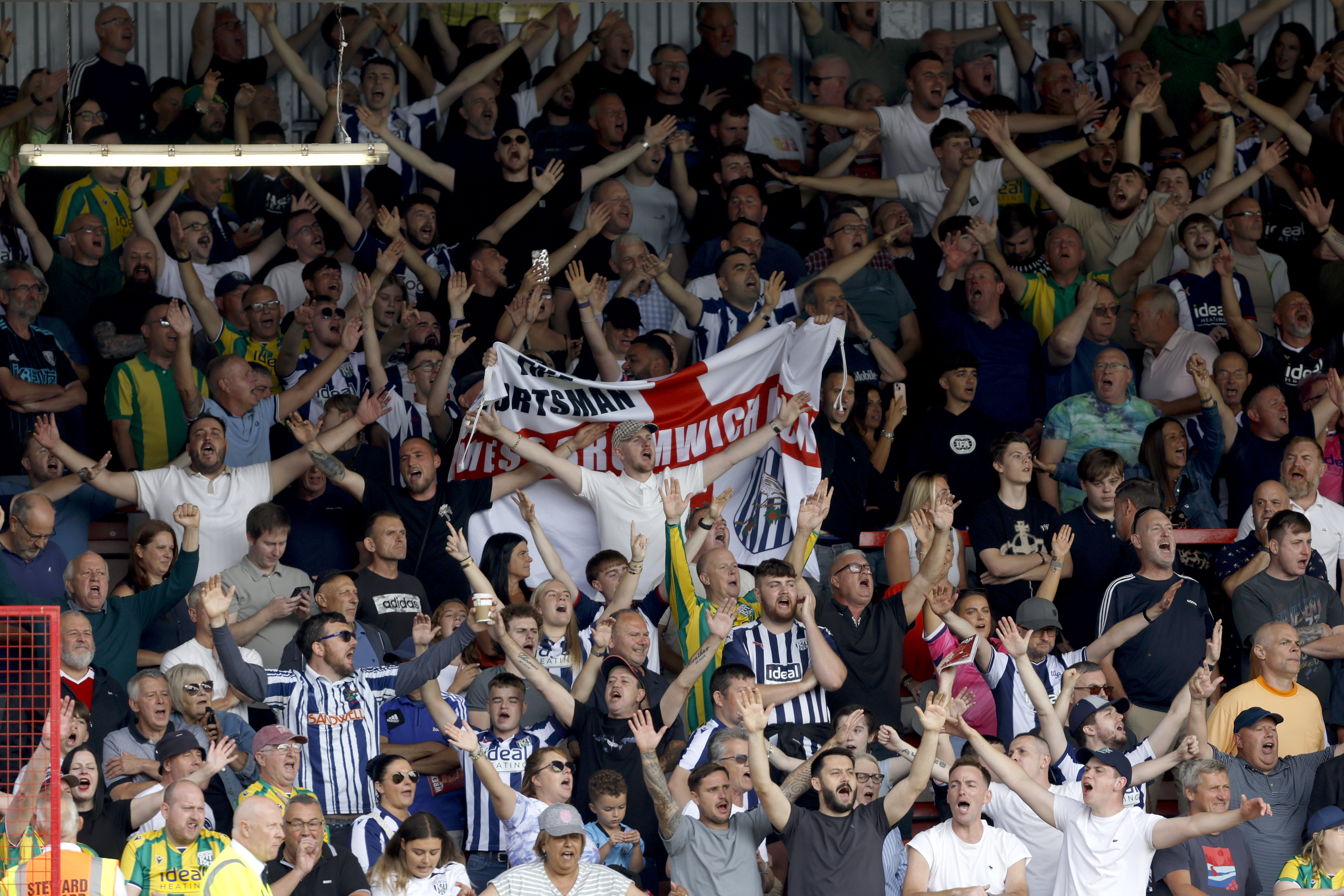 A general view of WBA fans cheering in a stand at a game
