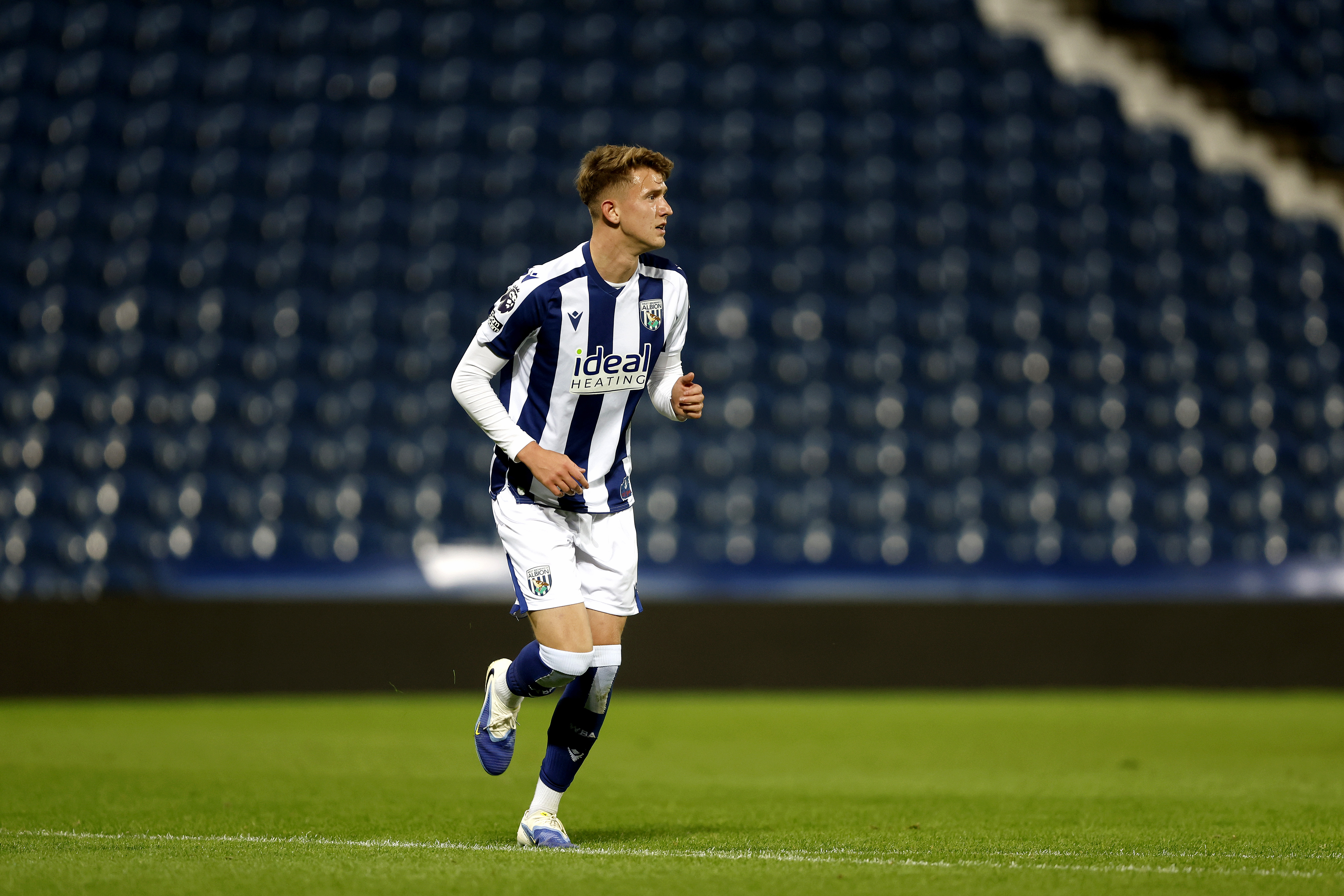Jack Bray in action in the home kit for WBA's PL2 team