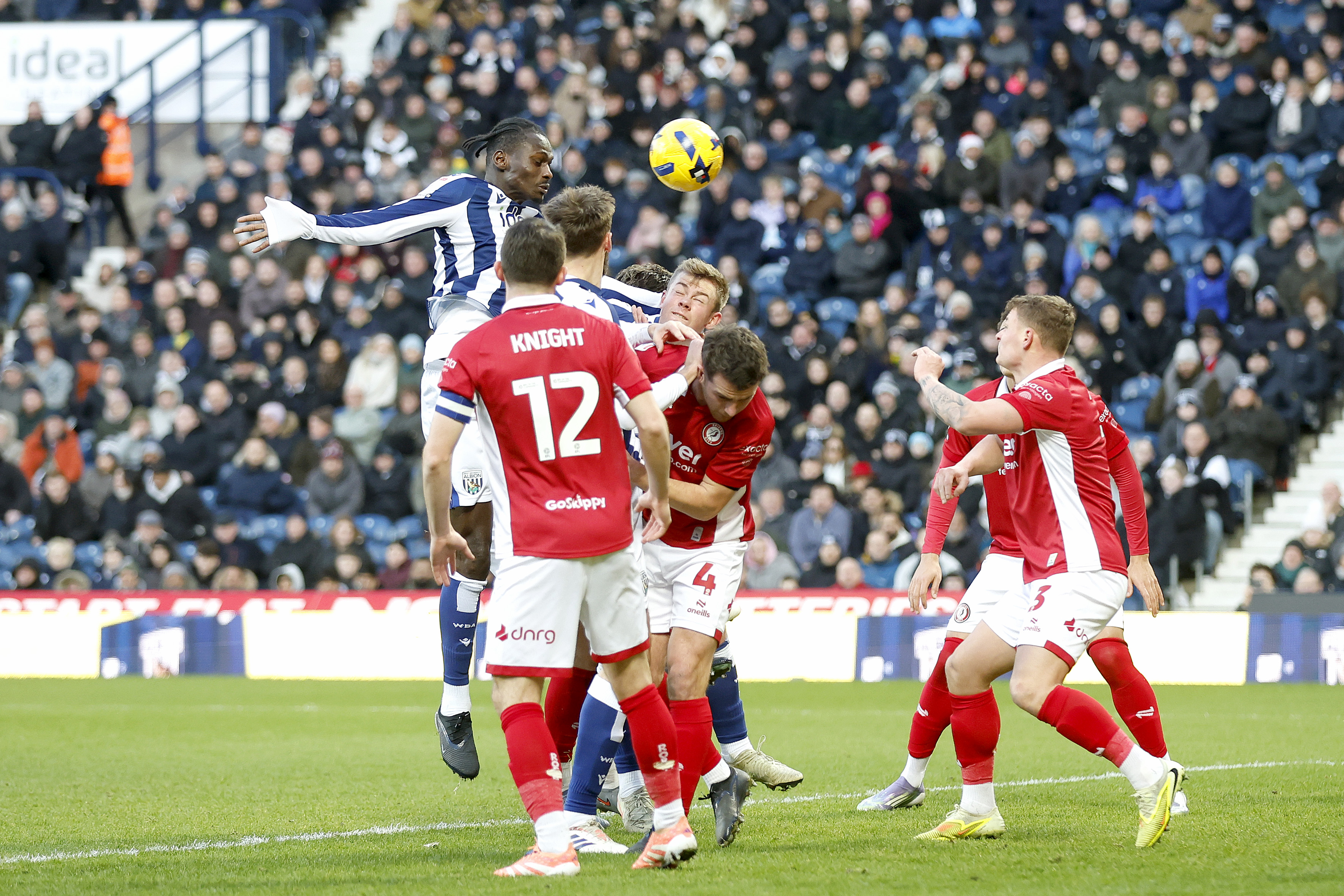 Several WBA & Bristol City players jumping to try and win the ball in the air in the penalty area