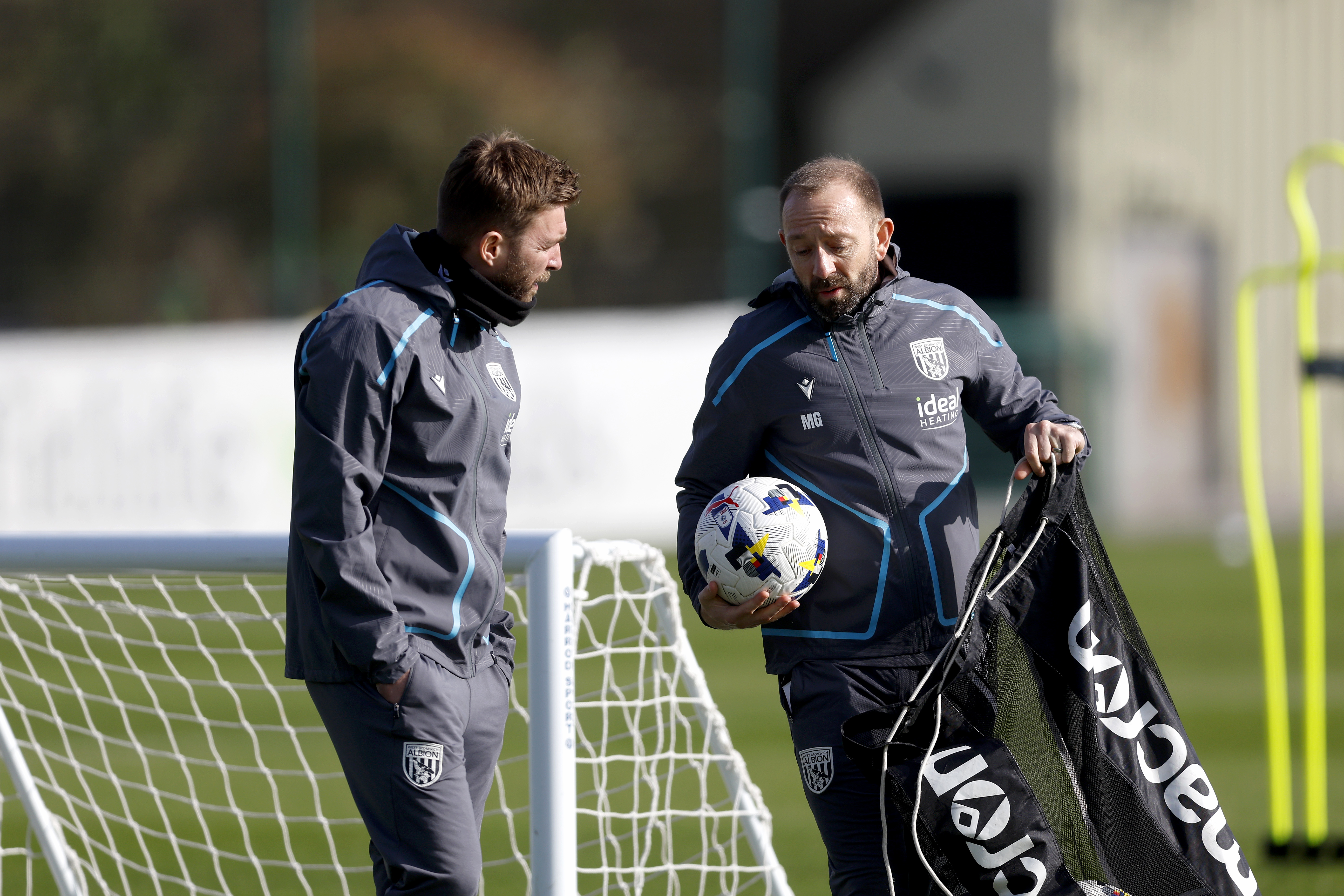 James Morrison talking to Matt Gill on the training pitch 