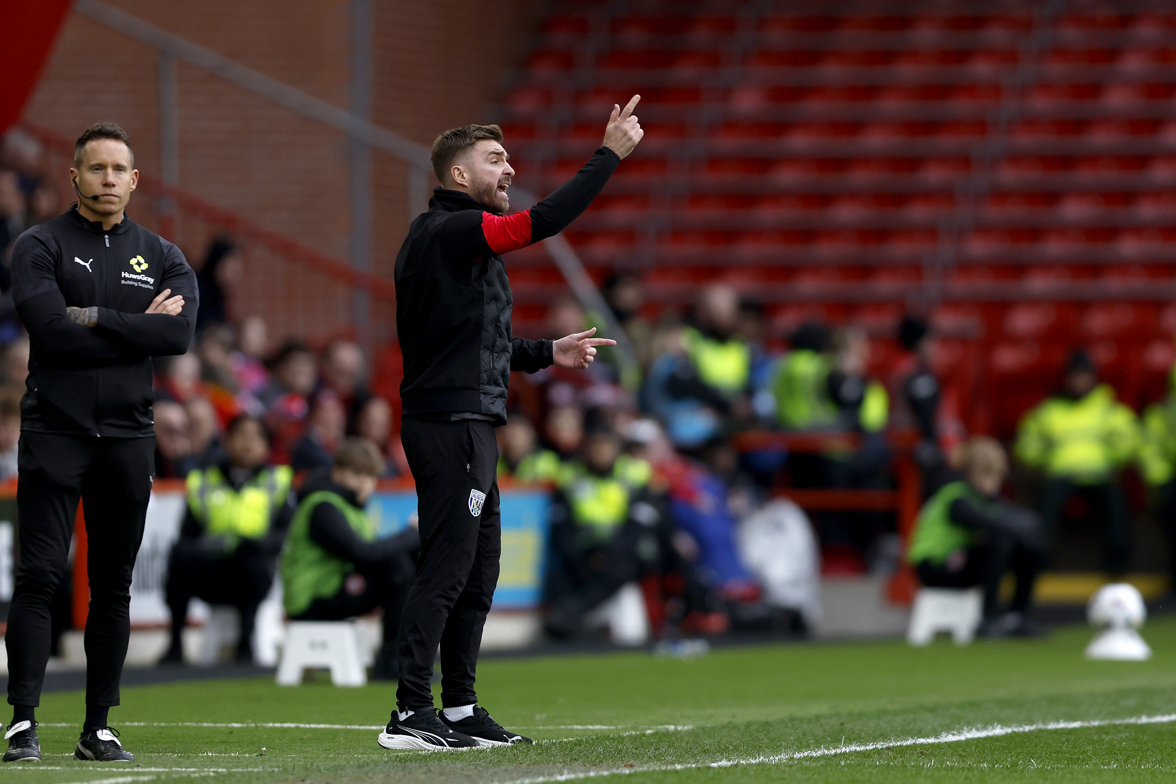 James Morrison giving instructions to players on the side of the pitch at Sheffield United 