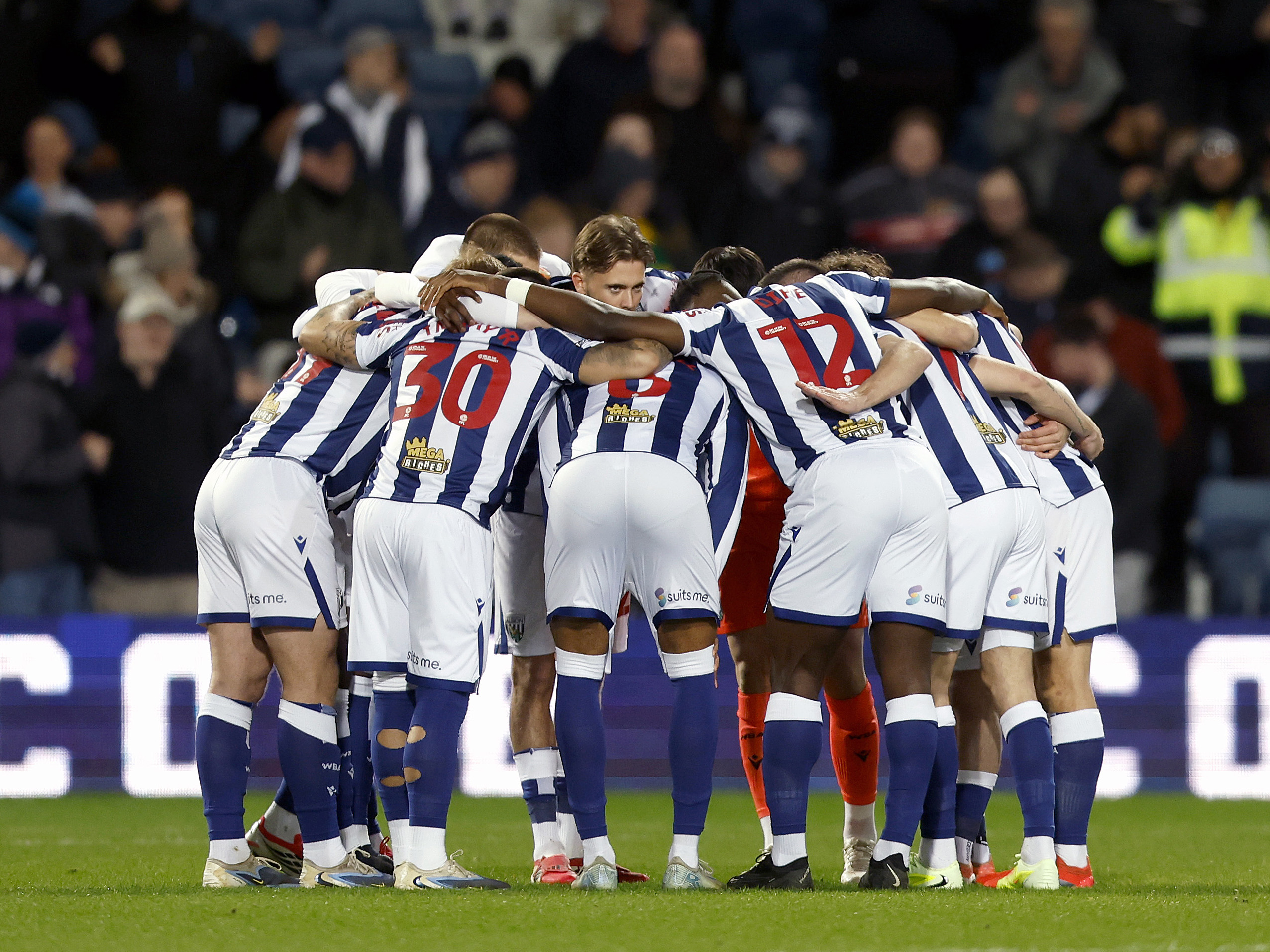 WBA in a pre-match huddle in the home kit before the Southampton game at The Hawthorns