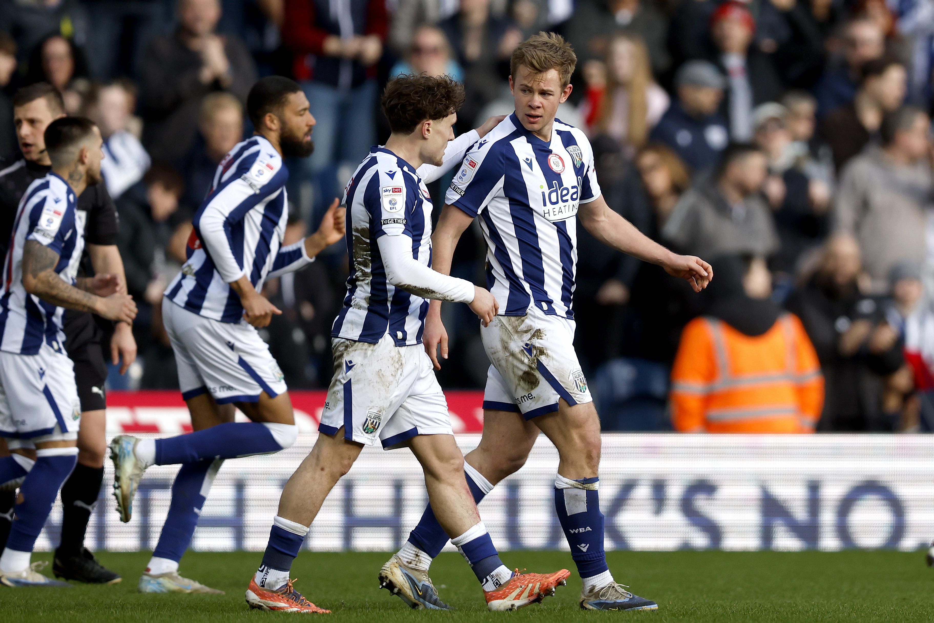 Aune Heggebø celebrates scoring a goal with team-mates in the home kit 
