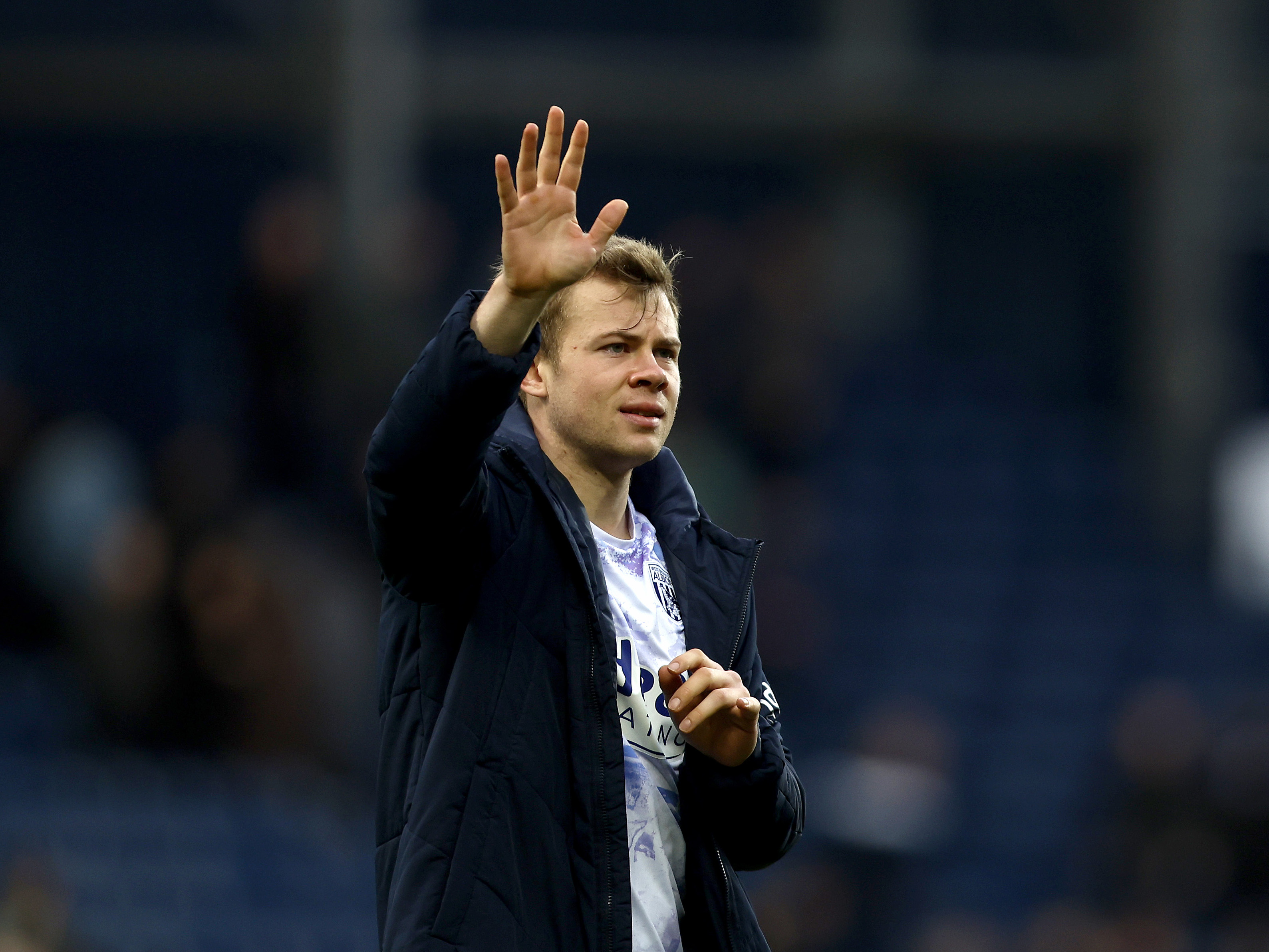 Aune Heggebø waving at WBA fans after a game 