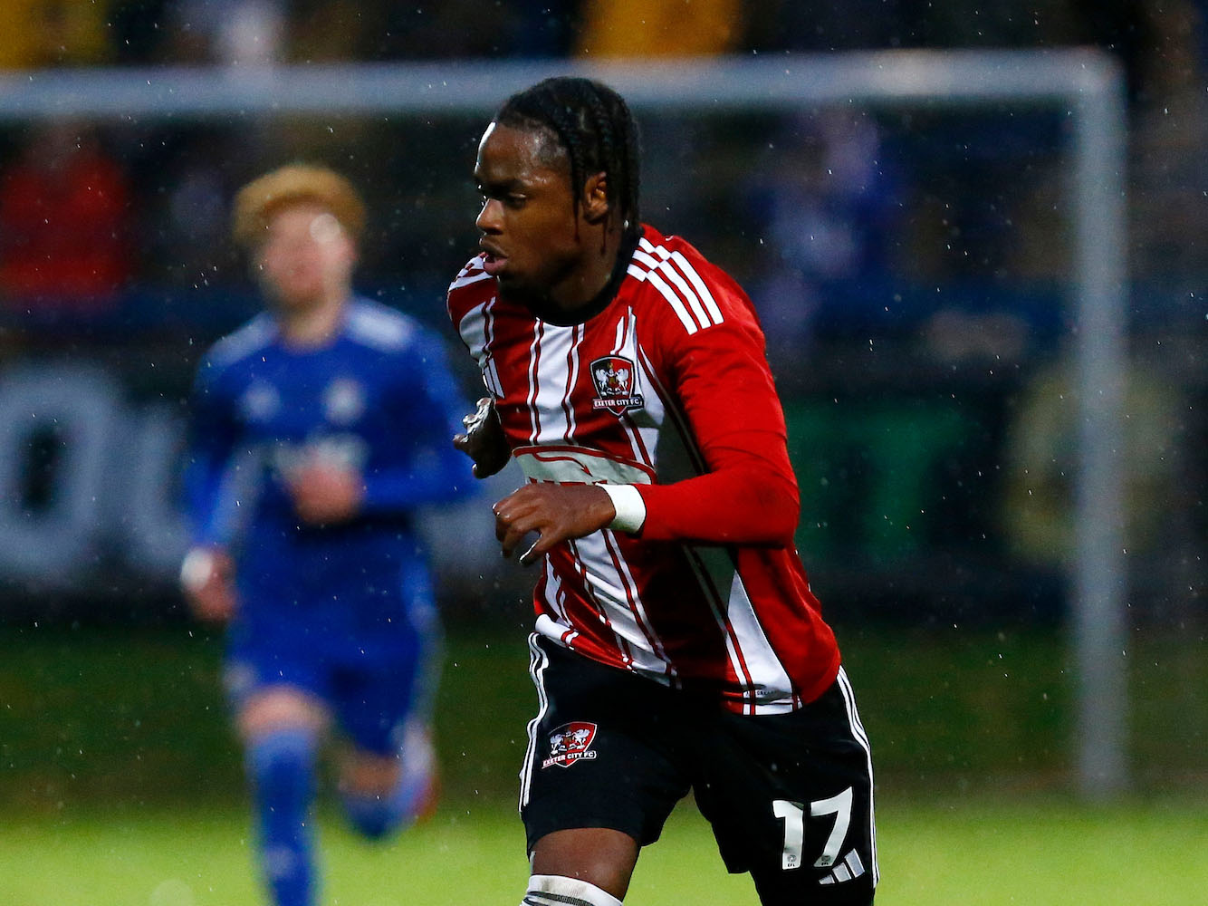A photo of youngster Akeel Higgins in action for loan side, Exeter City