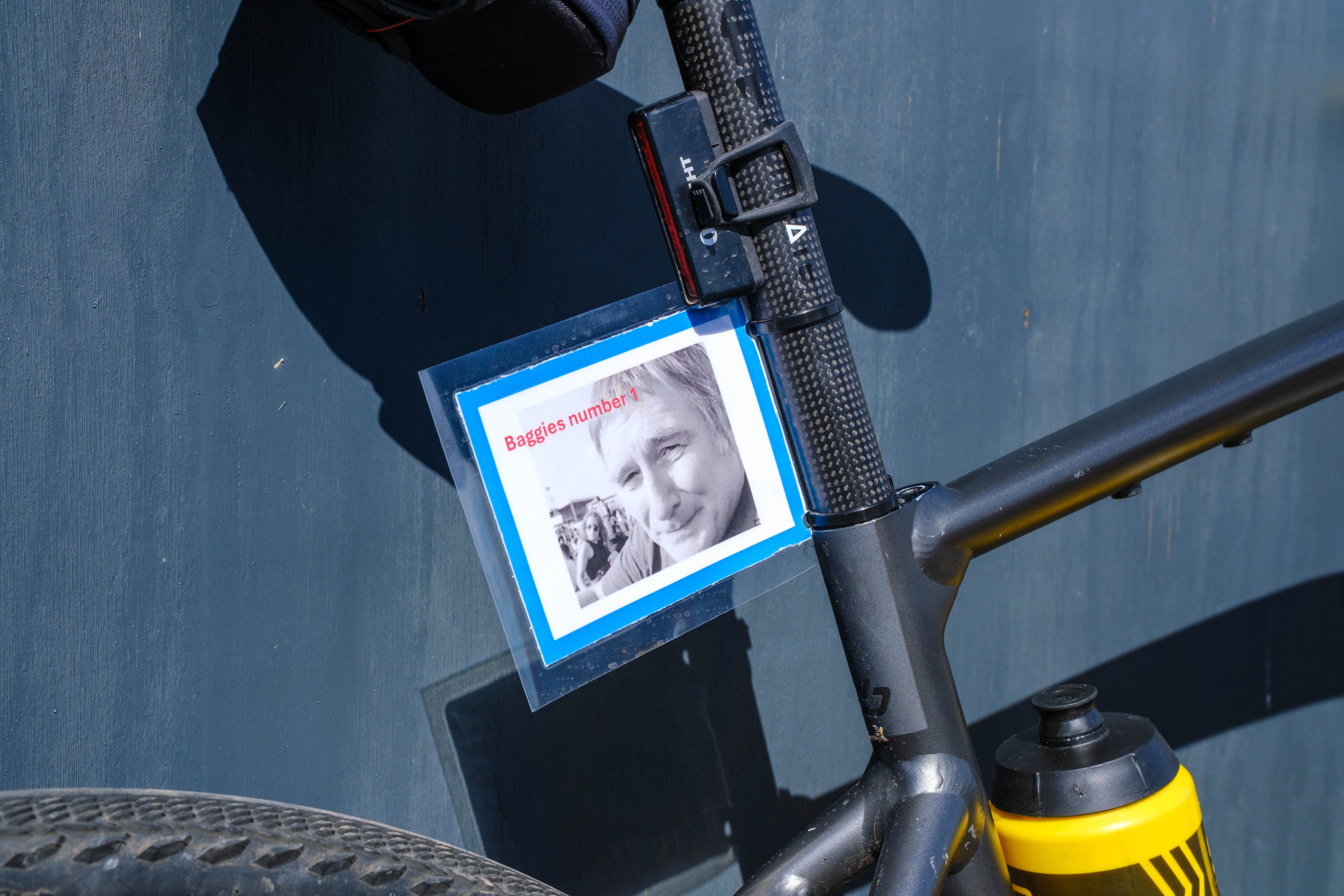 Close of cyclist's bike with tribute photo of Mark Townsend