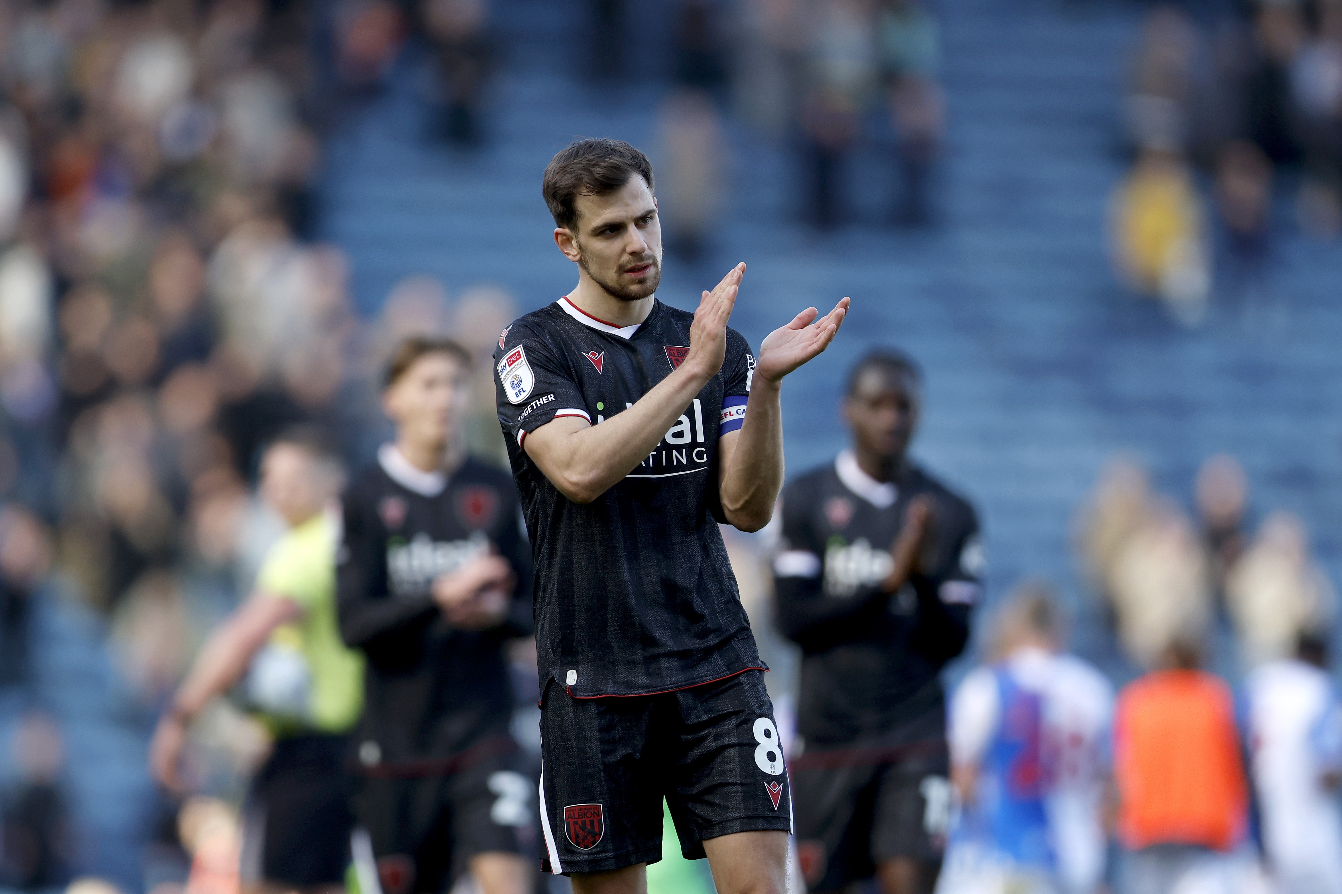 Jayson Molumby applauding WBA fans after the Blackburn game 