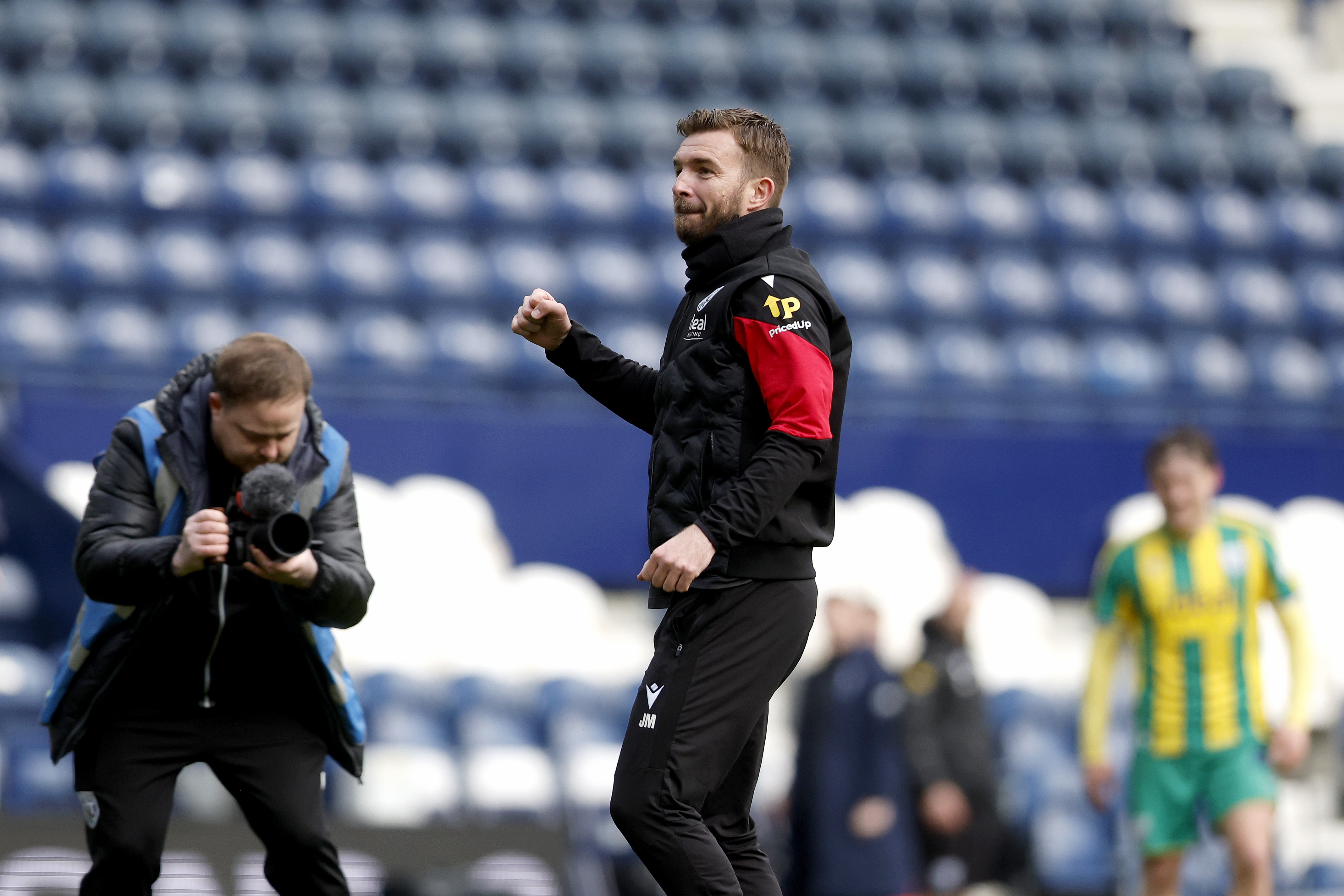 James Morrison celebrates in front of WBA fans at Deepdale 