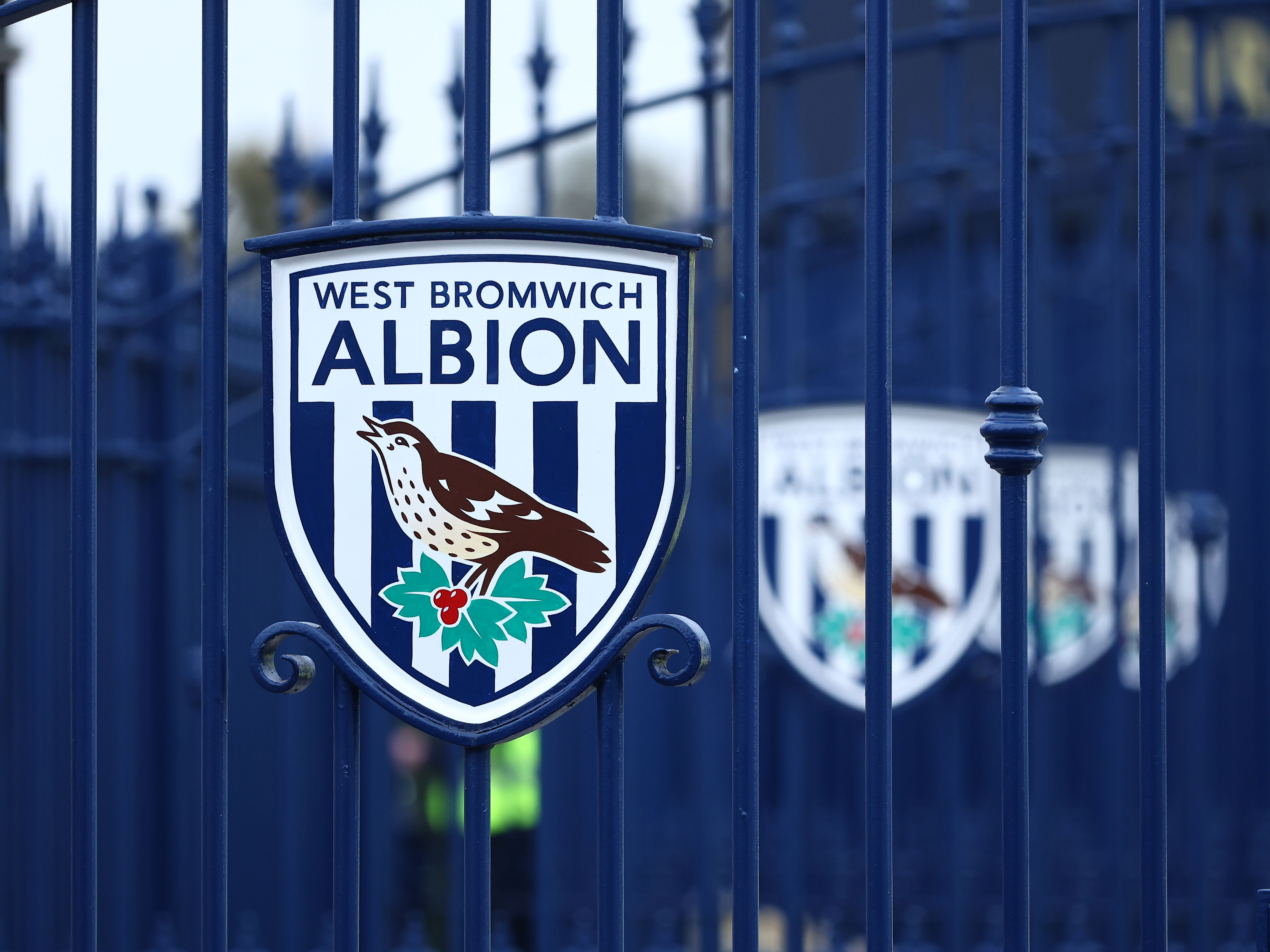 An image of the West Bromwich Albion badge on gates at The Hawthorns