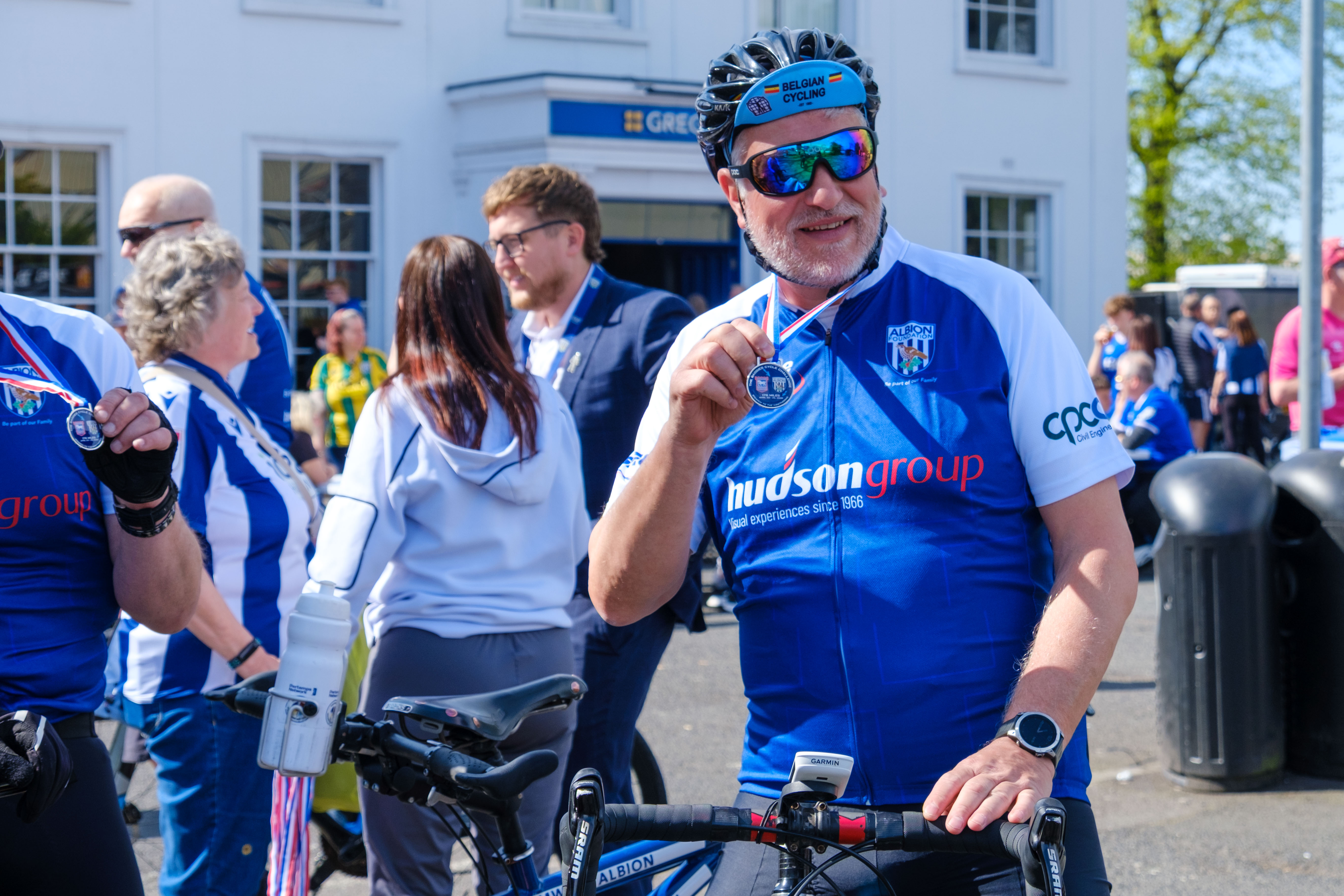 Steve Meeson holding his medal.