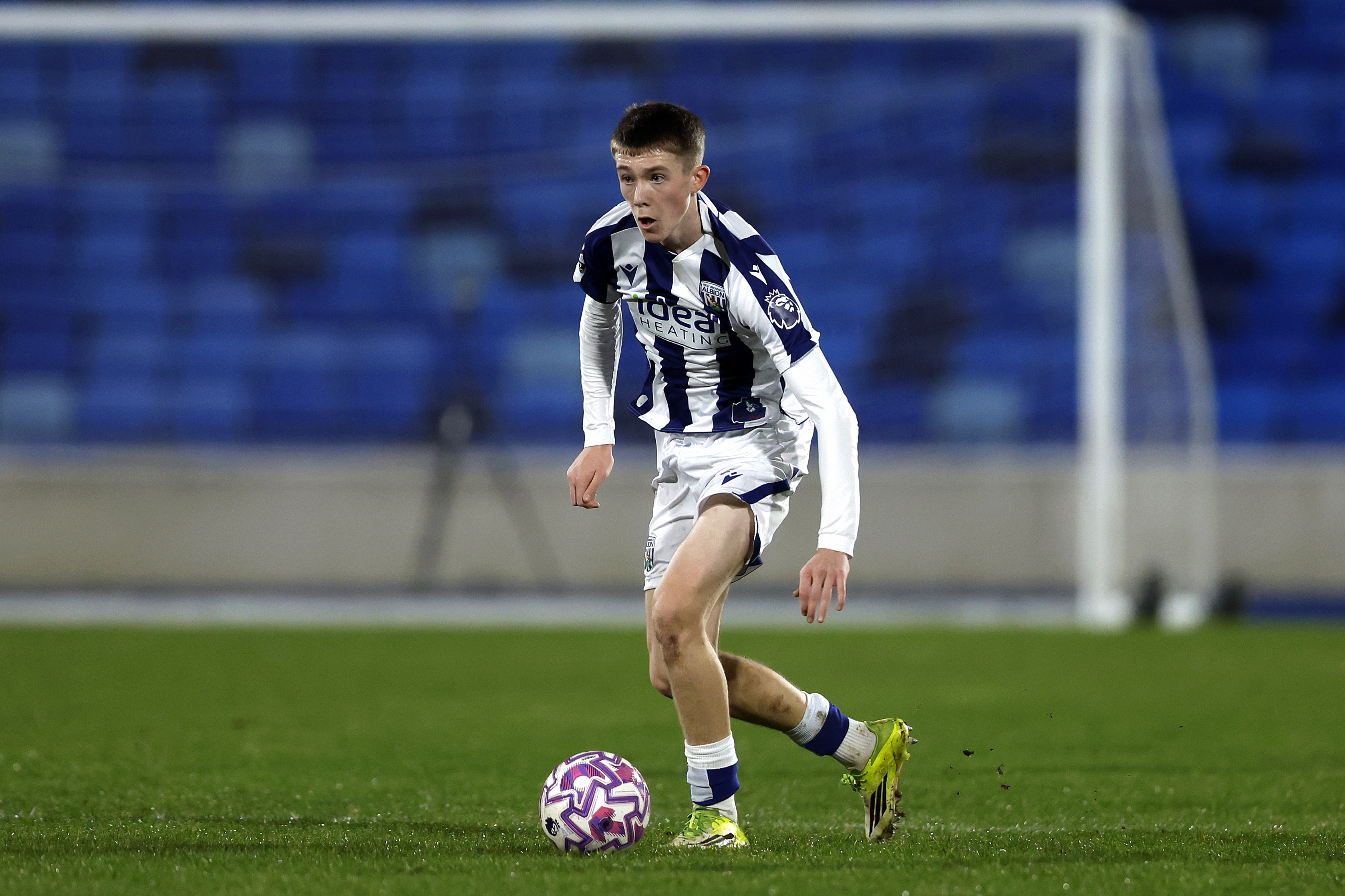 Ryan Colesby on the ball during a PL2 match in the home kit 