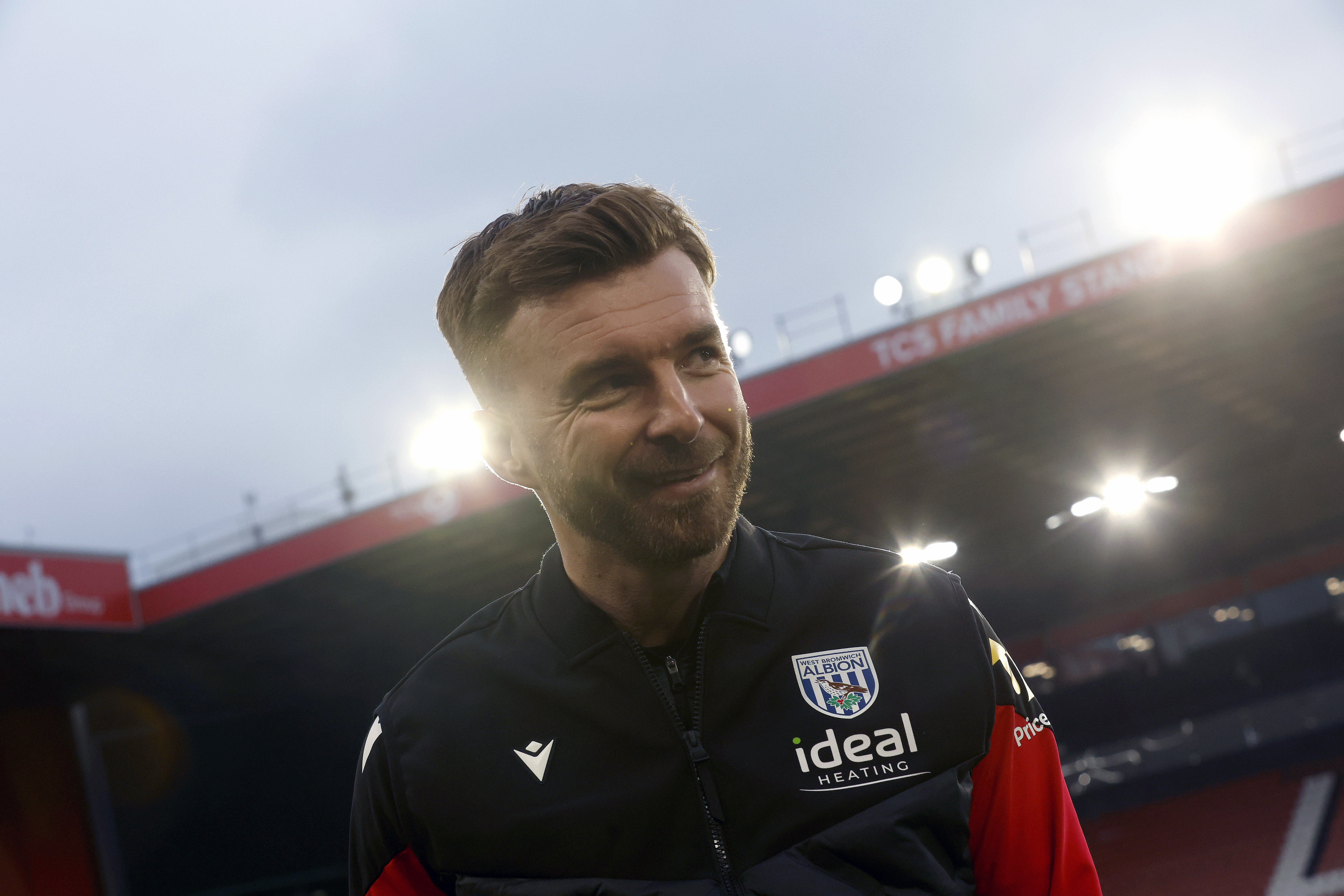 James Morrison smiling while in a WBA tracksuit 