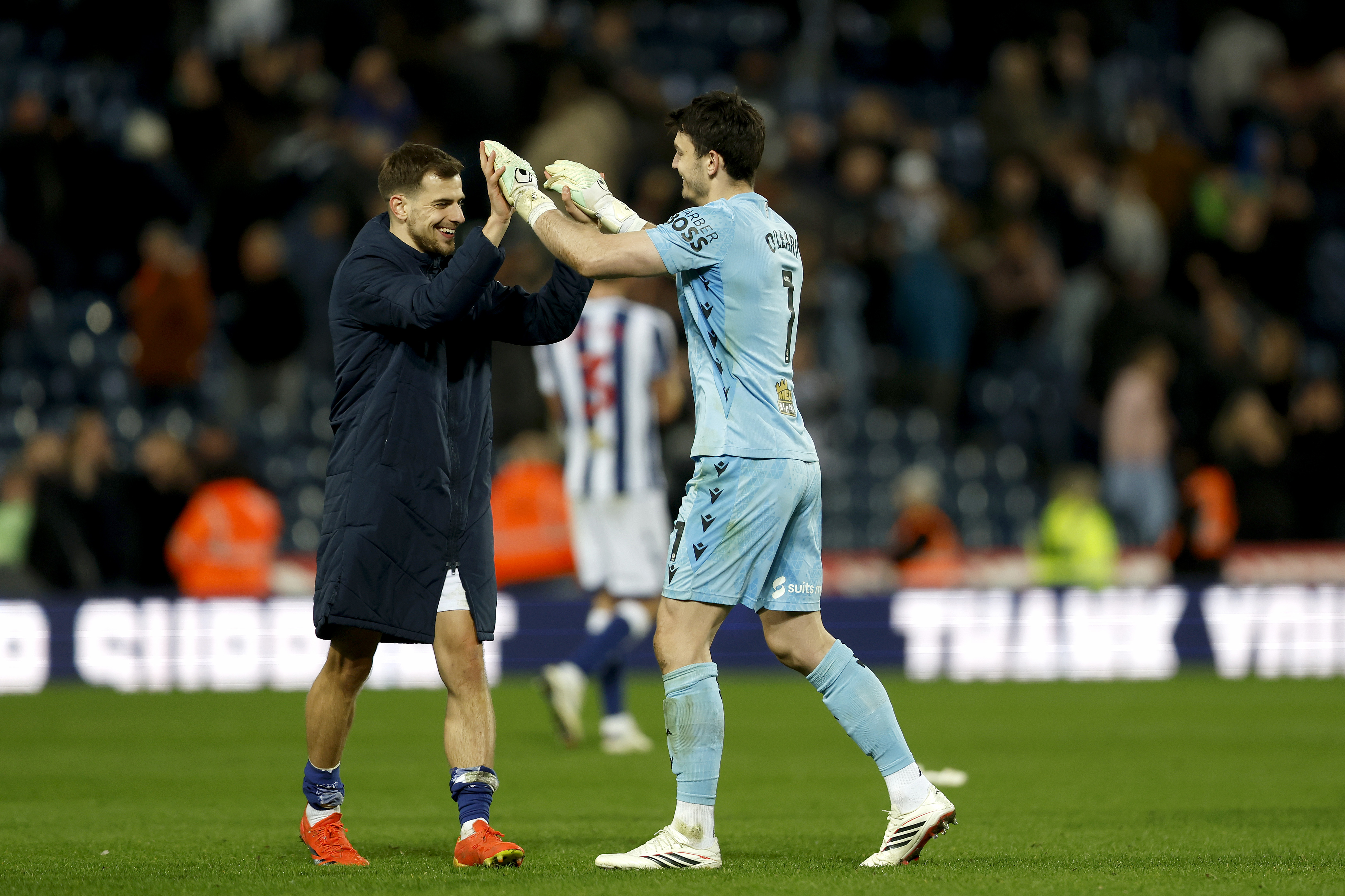 Jayson Molumby and Max O'Leary high-fiving after a game at The Hawthorns