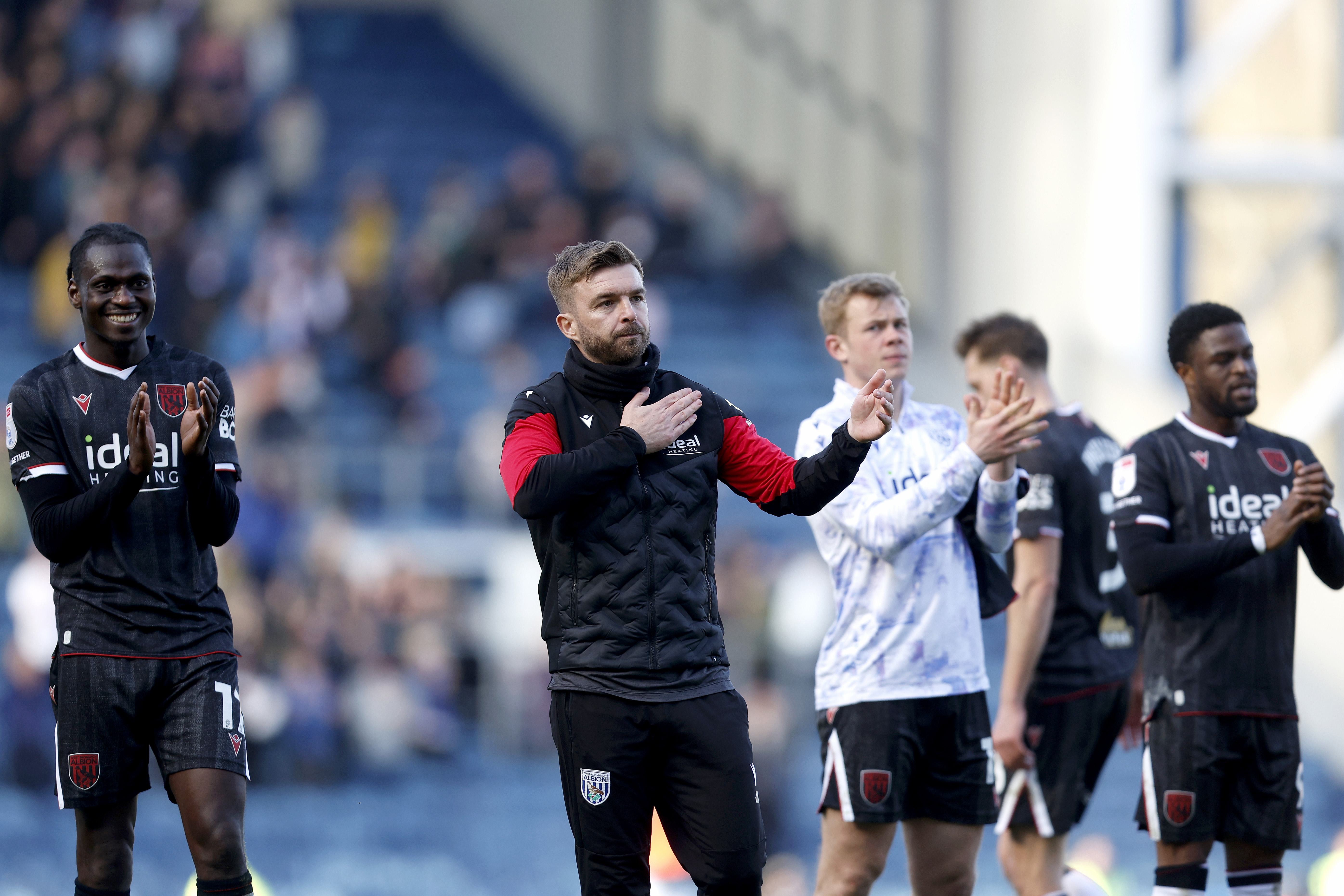 James Morrison applauds the away fans at full-time