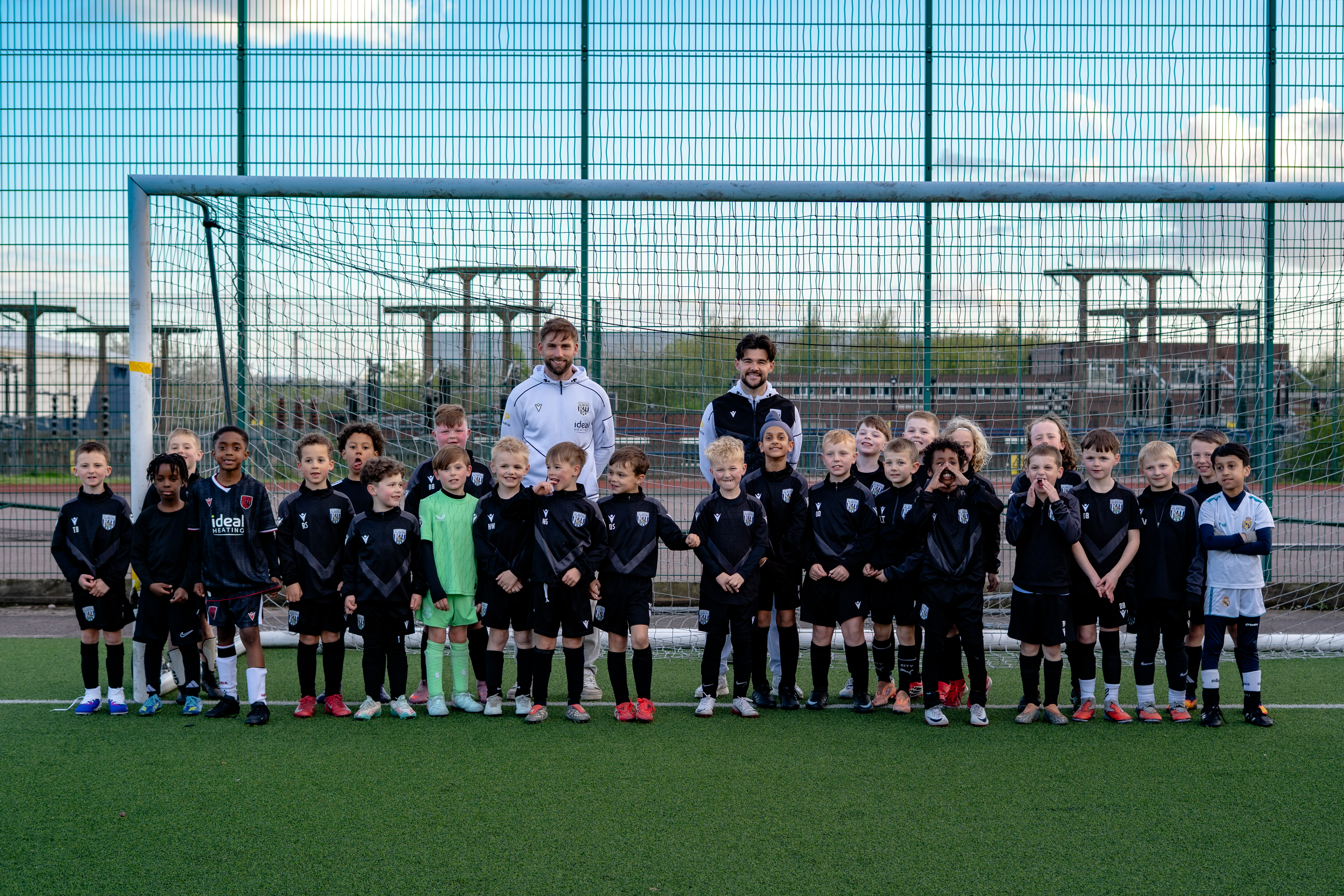 Alex Mowatt and Charlie Taylor in a group photo with a PDA Session